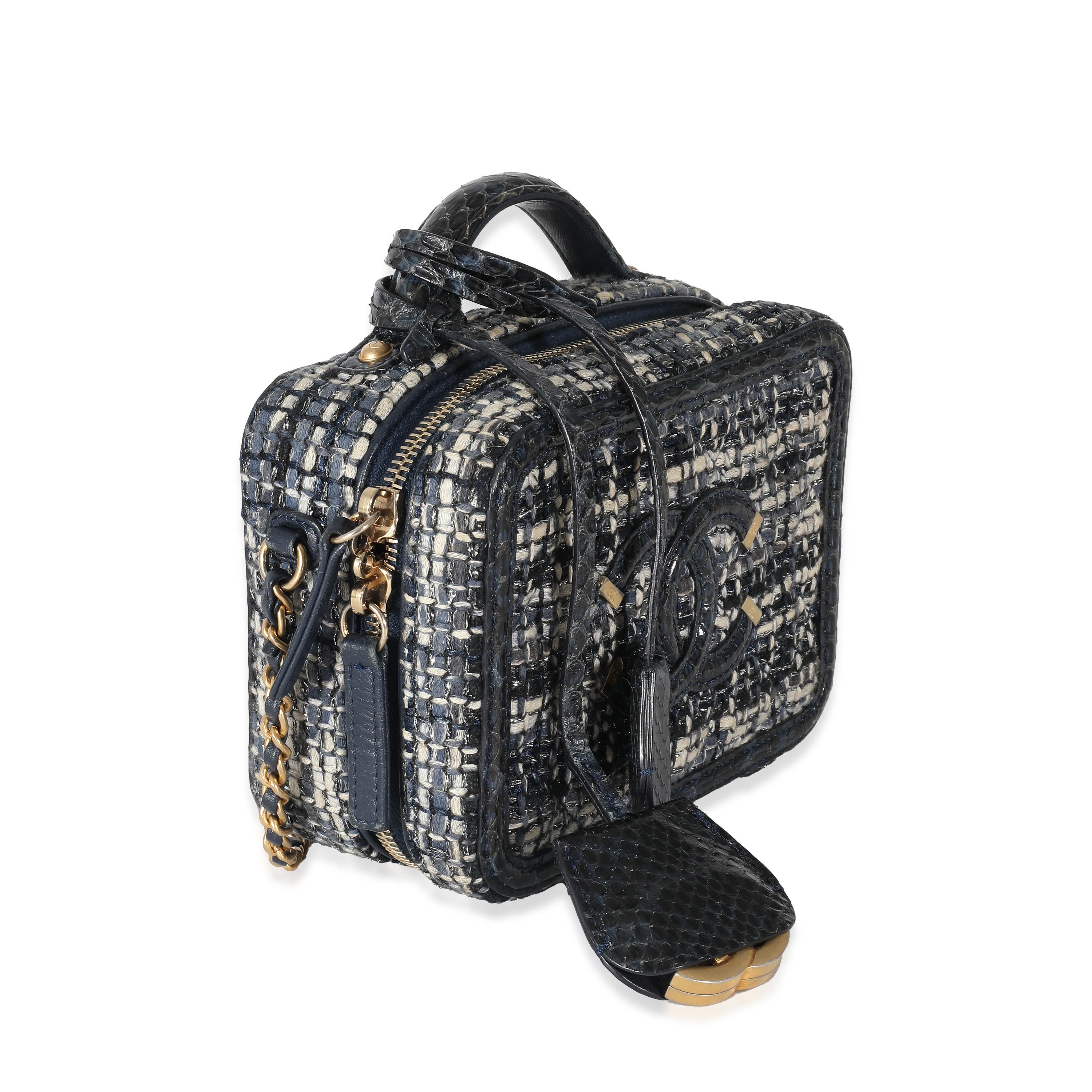Listing Title: Chanel Navy Tweed Snakeskin Small CC Filigree Vanity Case
SKU: 136877
Condition: Pre-owned 
Condition Description: Intrinsically Chanel, the medium Coco top handle bag was named after the maison's founder. Introduced in 2015, the bag