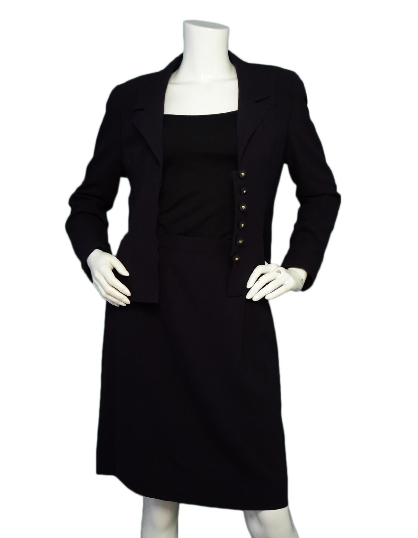 Chanel Navy Two-Piece Wool Skirt Suit 

Color: Navy
Materials: 100% wool
Lining: 95% silk, 5% lycra
Opening/Closure: Front button closures (jacket), Hidden back zipper (skirt)
Overall Condition: Excellent pre-owned condition, with the exception of