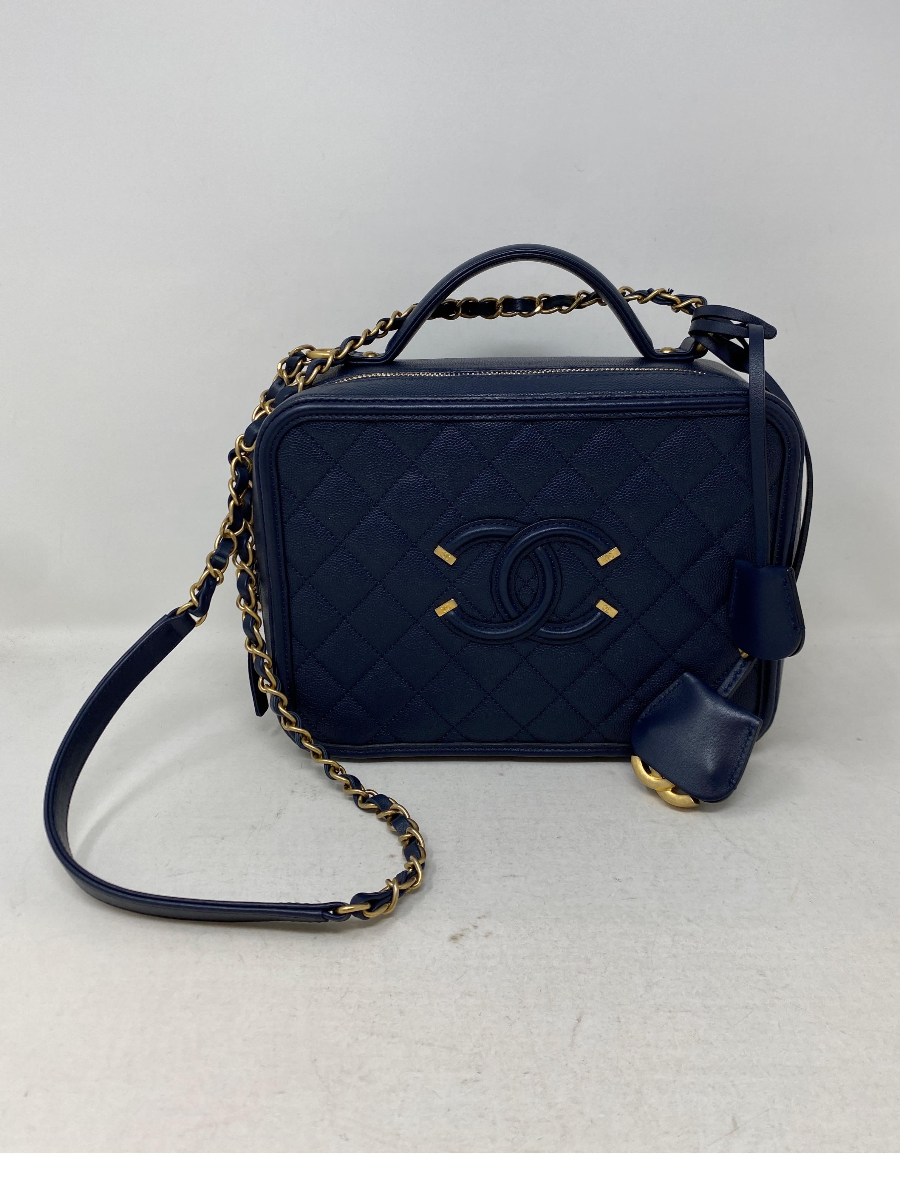 Chanel Navy Blue Vanity Bag. Caviar leather. Excellent condition. Gold hardware. Hard to find vanity bag. Collector's piece. Includes authenticity card and dust bag. Guaranteed authentic. 