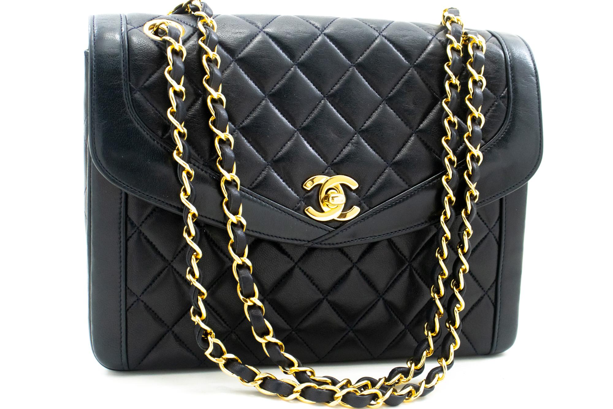 An authentic CHANEL NAVY Vintage Chain Shoulder Bag made of black Lambskin Quilted Flap Purse. The color is Dark Navy. The outside material is Leather. The pattern is Solid. This item is Vintage / Classic. The year of manufacture would be