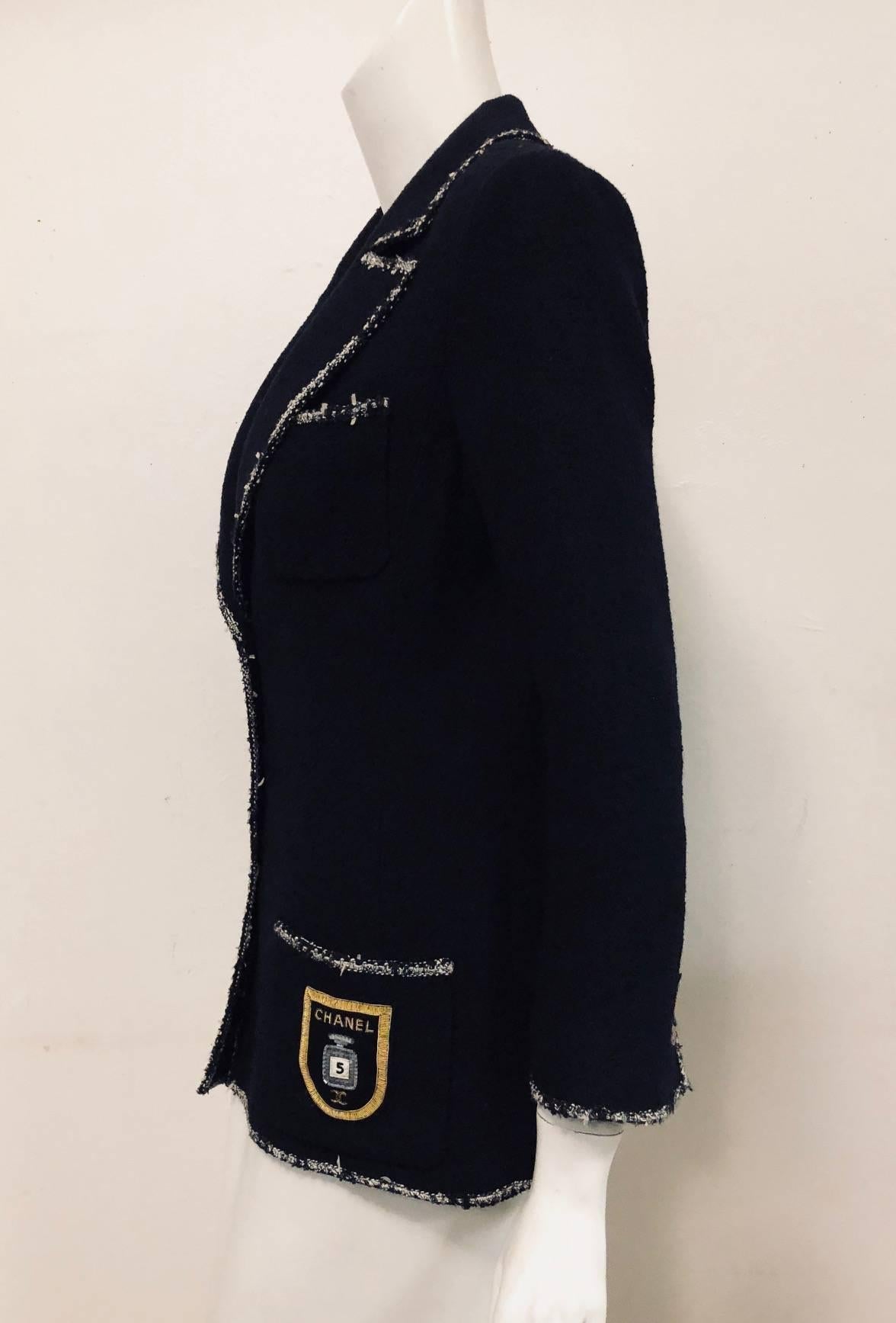 Chanel Navy Wool Boucle Fitted Jacket illustrates why Karl Lagerfeld is known as the 