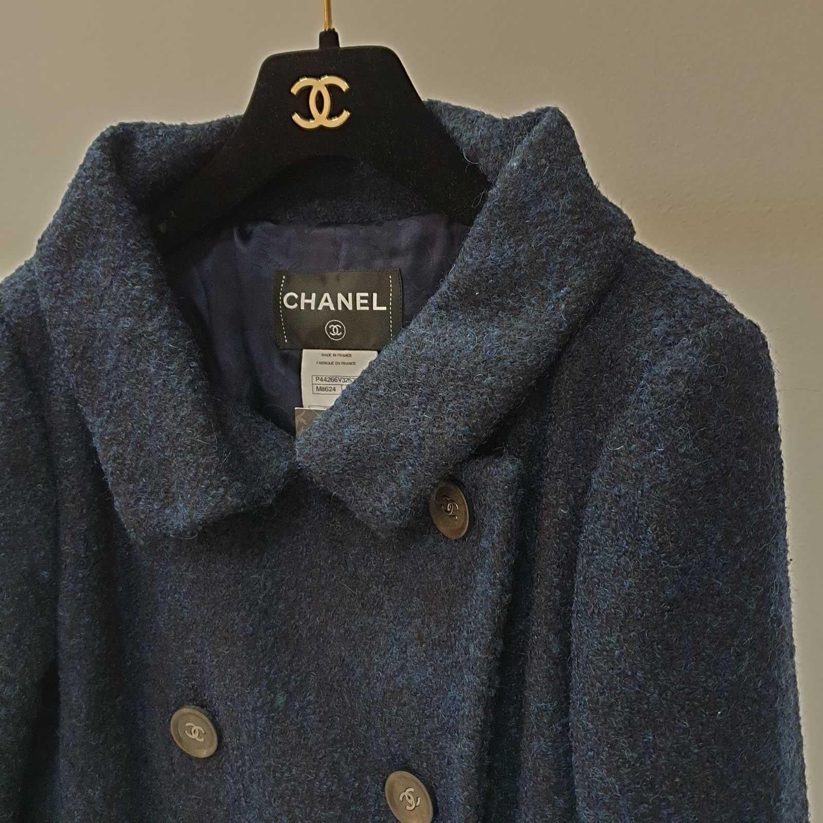 Chanel Navy Wool Long Length Coat CC Buttons

Product details:
Size FR 36
Double lined w/ Chanel logo navy silk fabric 
Silver tone CC buttons
Front button closure 
59% Wool, 24% nylon, 17% alpaca
Very good condition.
For buyers from EU we can