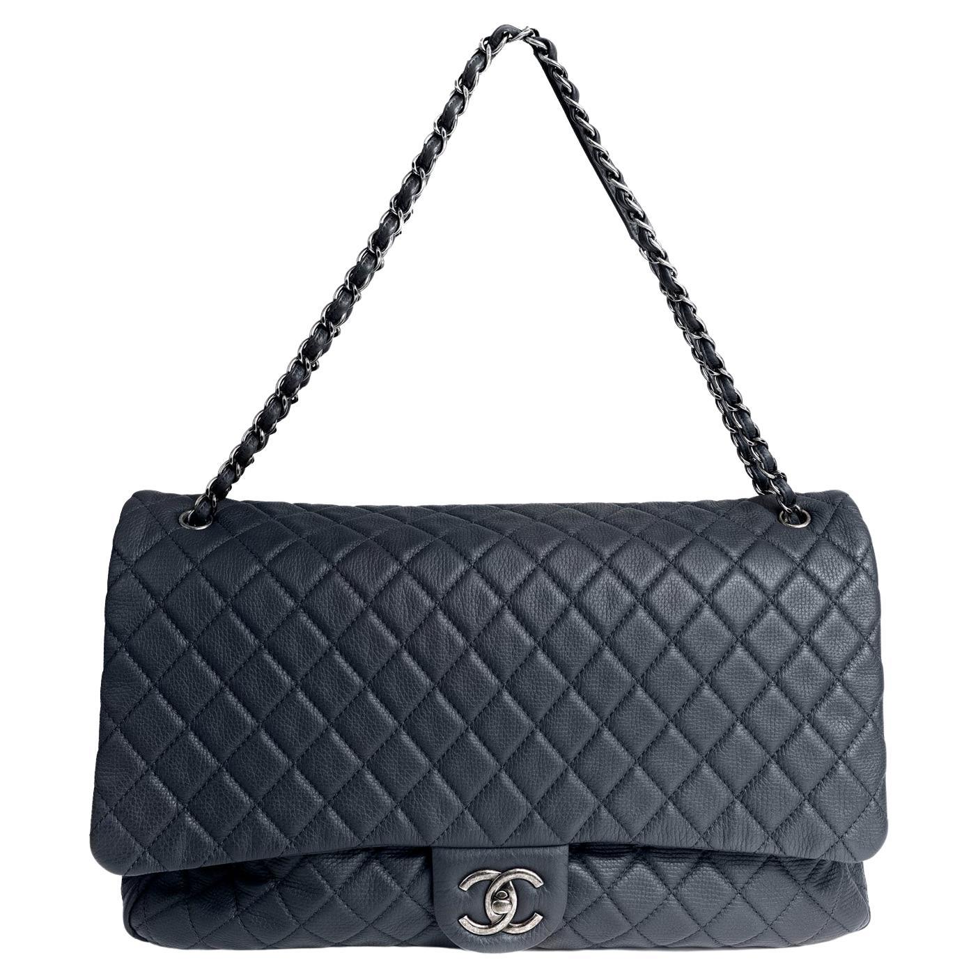 Get your hands on the stunning CHANEL NAVY XXL TRAVEL CLASSIC FLAP