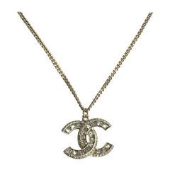 CHANEL Necklace Chain in gilded Metal and CC Pendant set with Brilliants