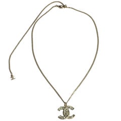 CHANEL Necklace Chain in gilded Metal and CC Pendant set with Brilliants