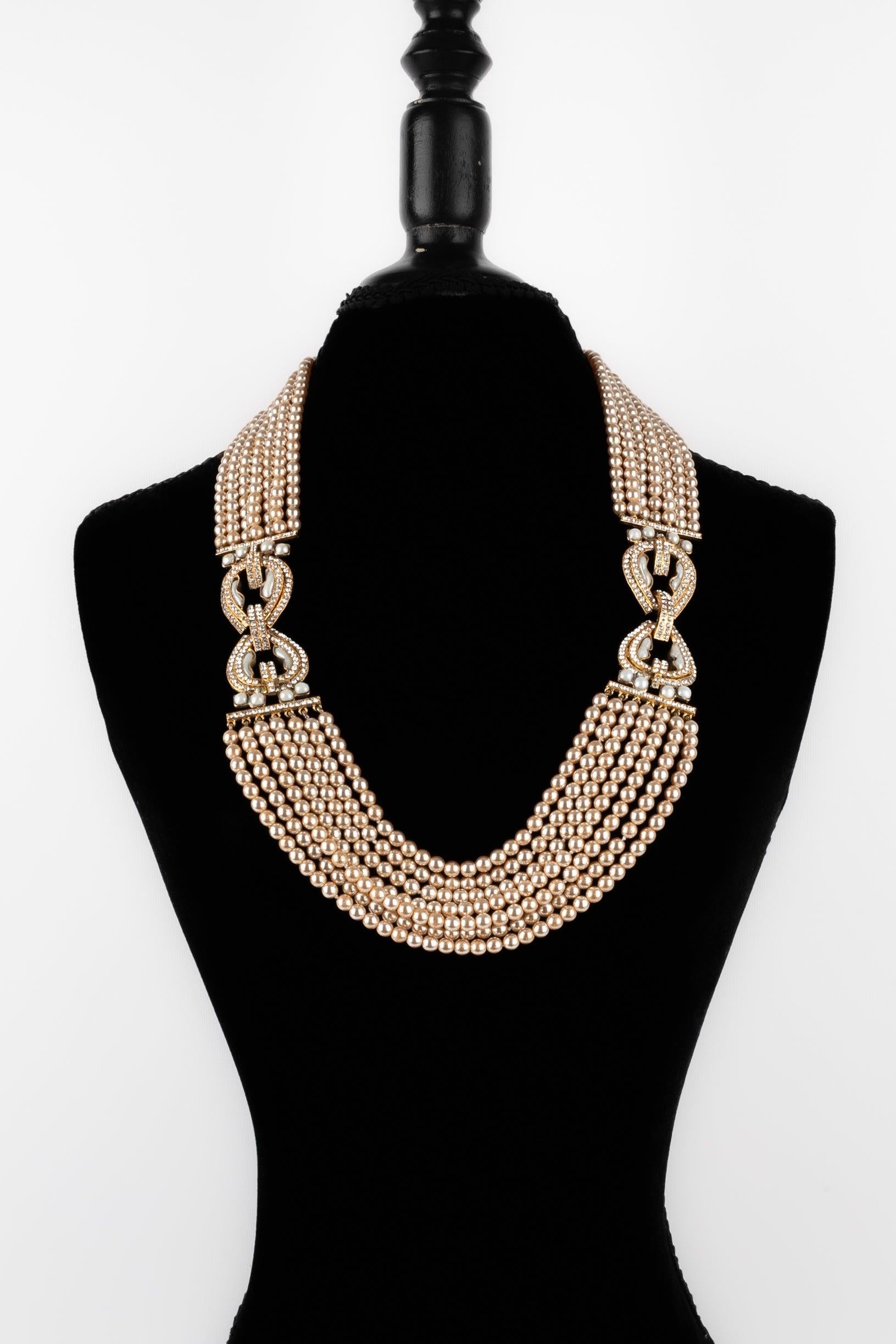 Chanel - (Made in France) Multi-row golden metal necklace with costume pearls, rhinestones, and glass paste with a pearly effect. 2cc3 Haute Couture Collection under the direction of Karl Lagerfeld.

Additional information:
Condition: Good
