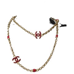 Chanel Necklace in gold metal and bordeaux pearl