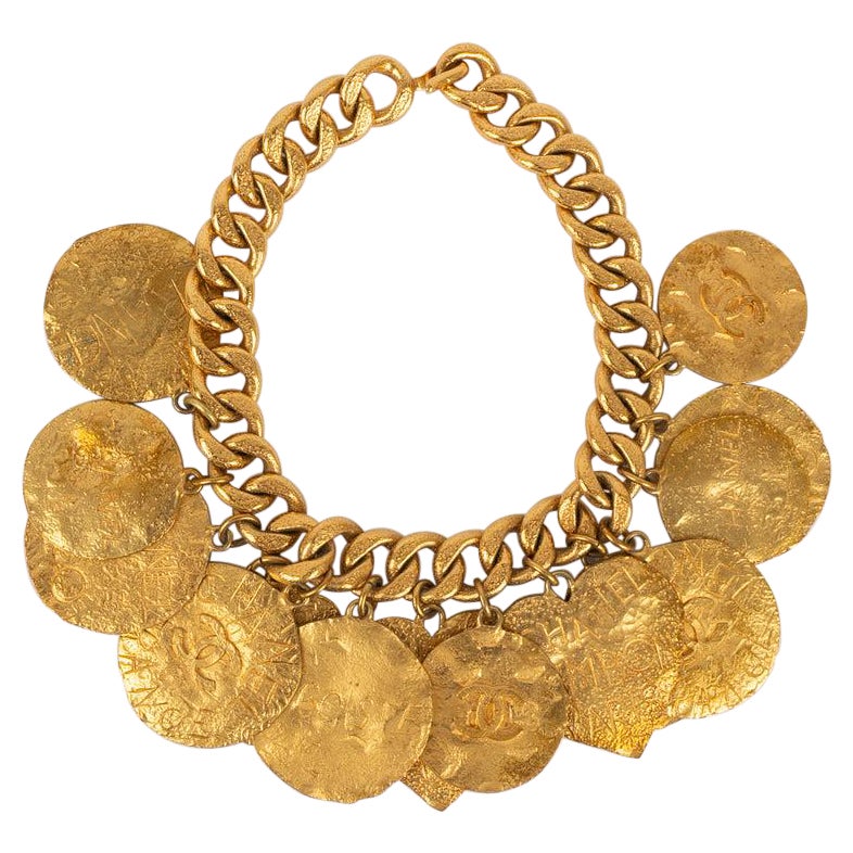 Chanel Halskette aus Gold und Metall mit mehreren Anhängern