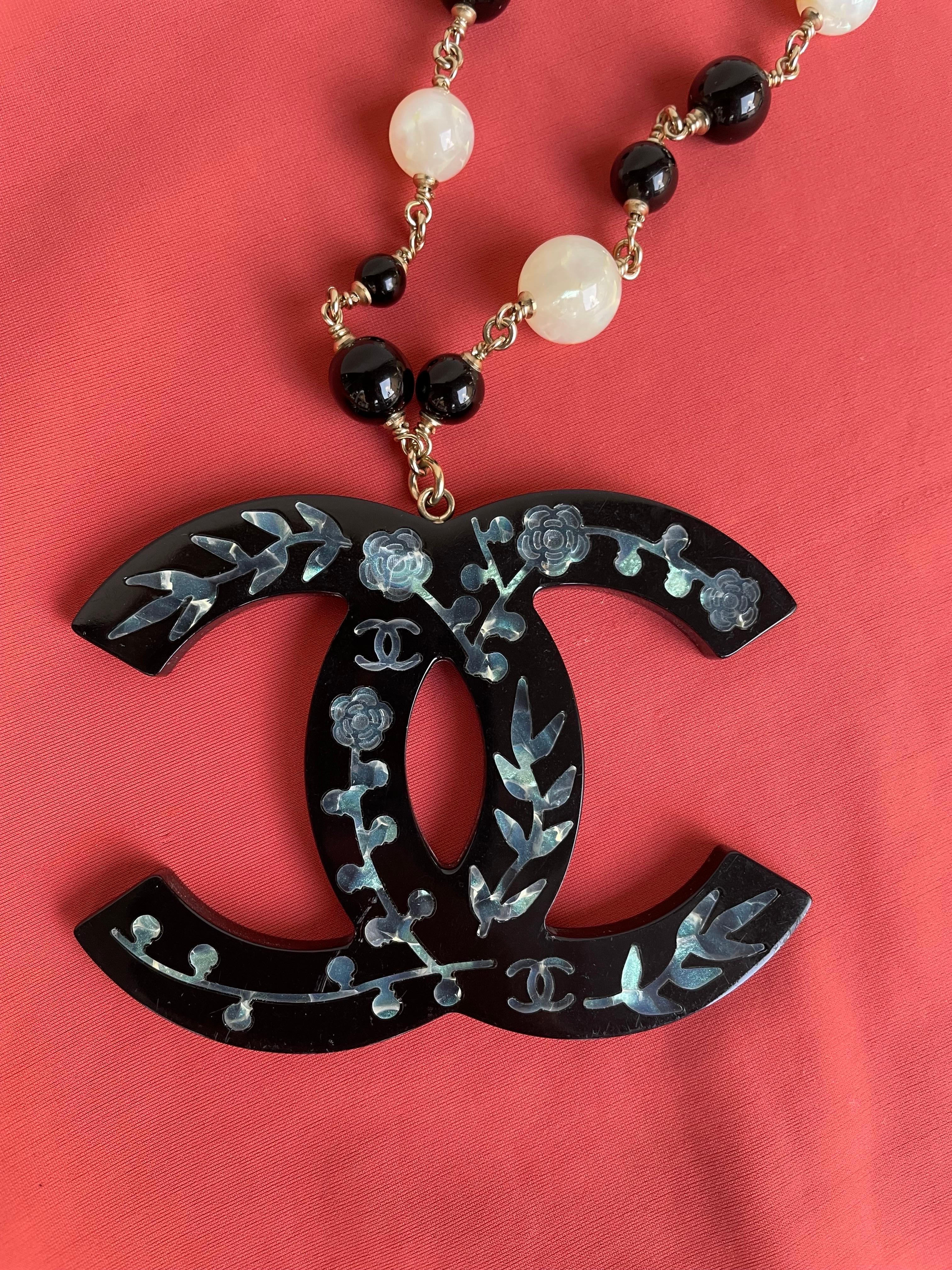 Black Chanel necklace. Pre Fall 2010 Shangai.