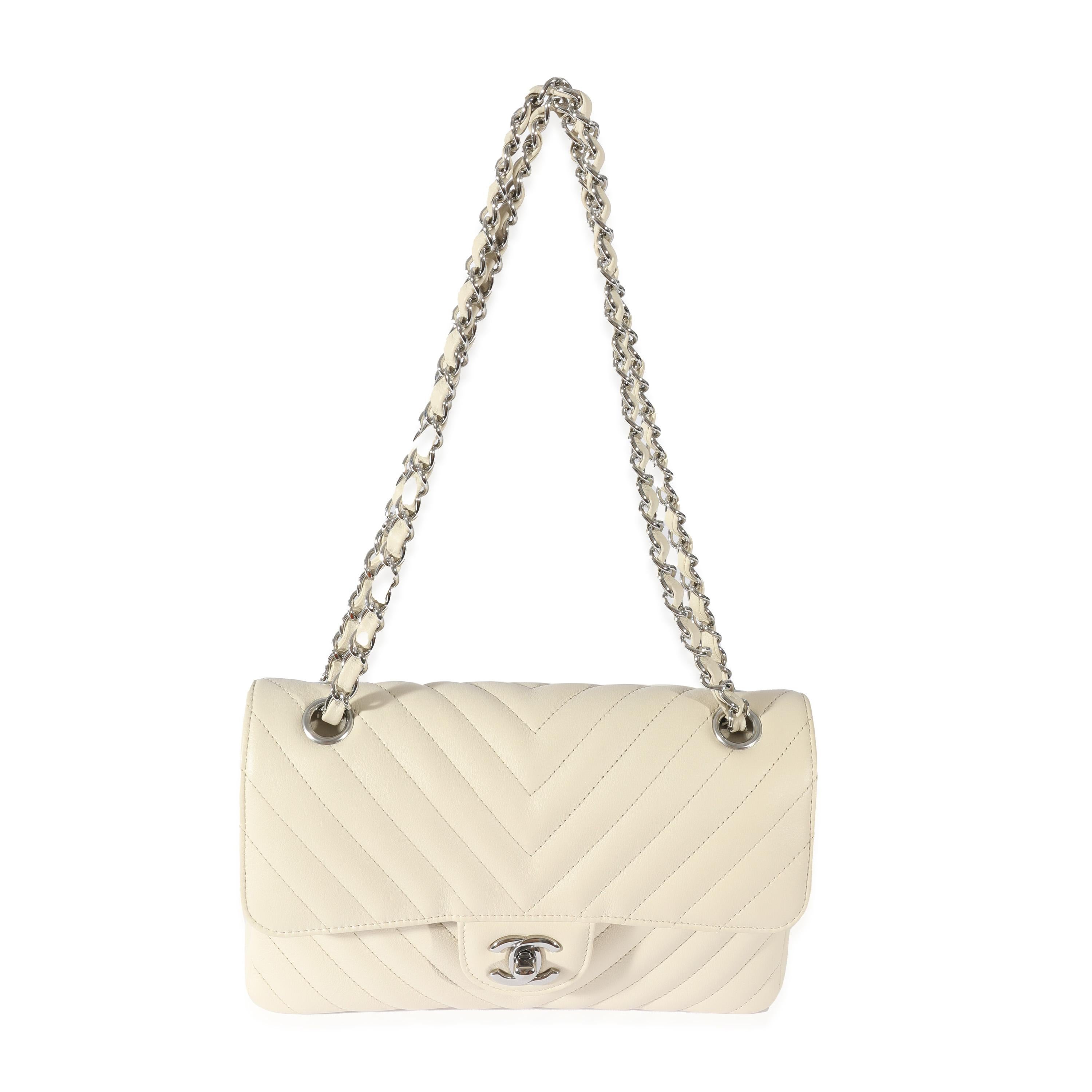 Listing Title: Chanel Neutral Chevron Quilted Leather Small Classic Flap
 SKU: 128515
 MSRP: 8800.00
 Condition: Pre-owned 
 Condition Description: A timeless classic that never goes out of style, the flap bag from Chanel dates back to 1955 and has