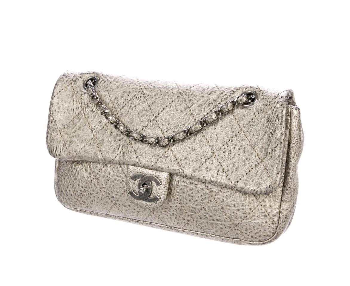 Leather
Antiqued silver-tone hardware
Woven lining
Turn lock closure
Shoulder strap drop 16