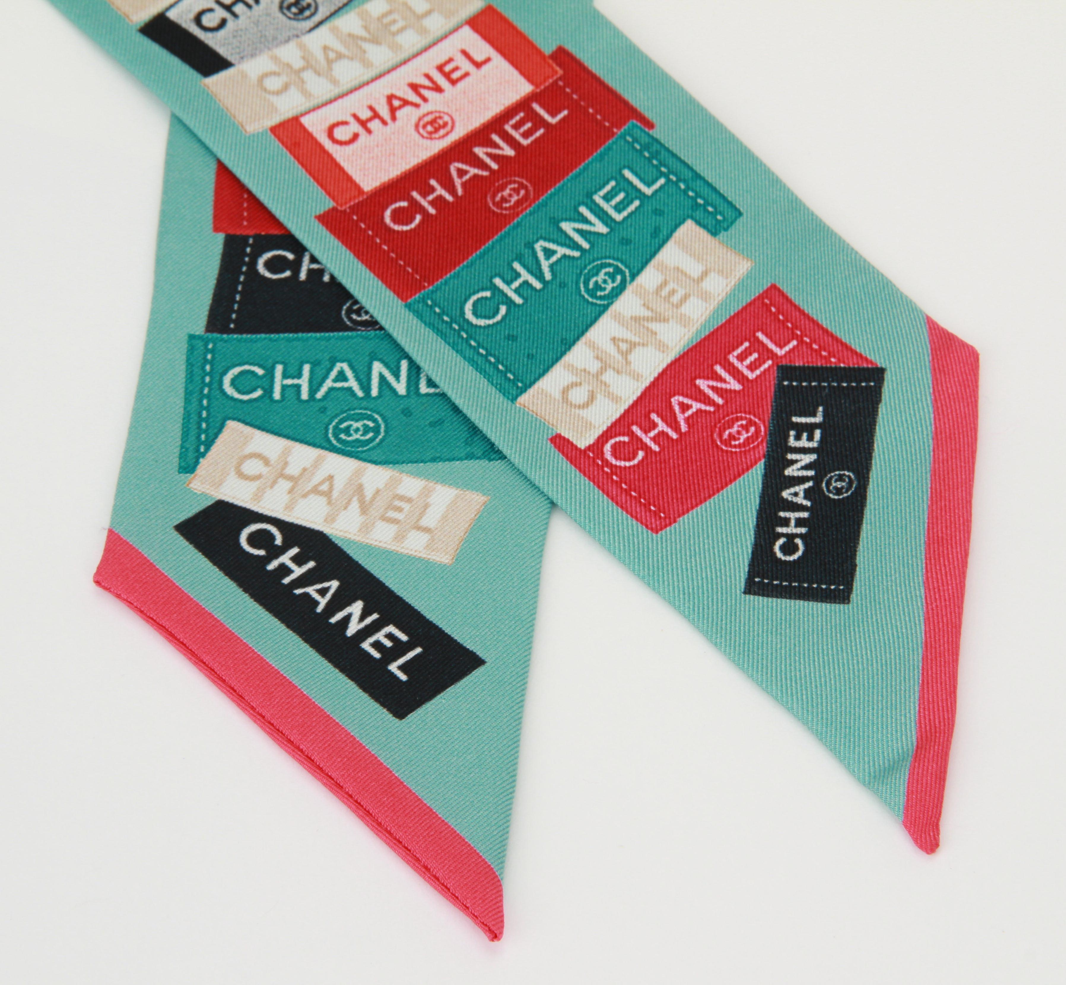 Chanel new aqua silk twilly with multicolor labels design. Missing label and tag.