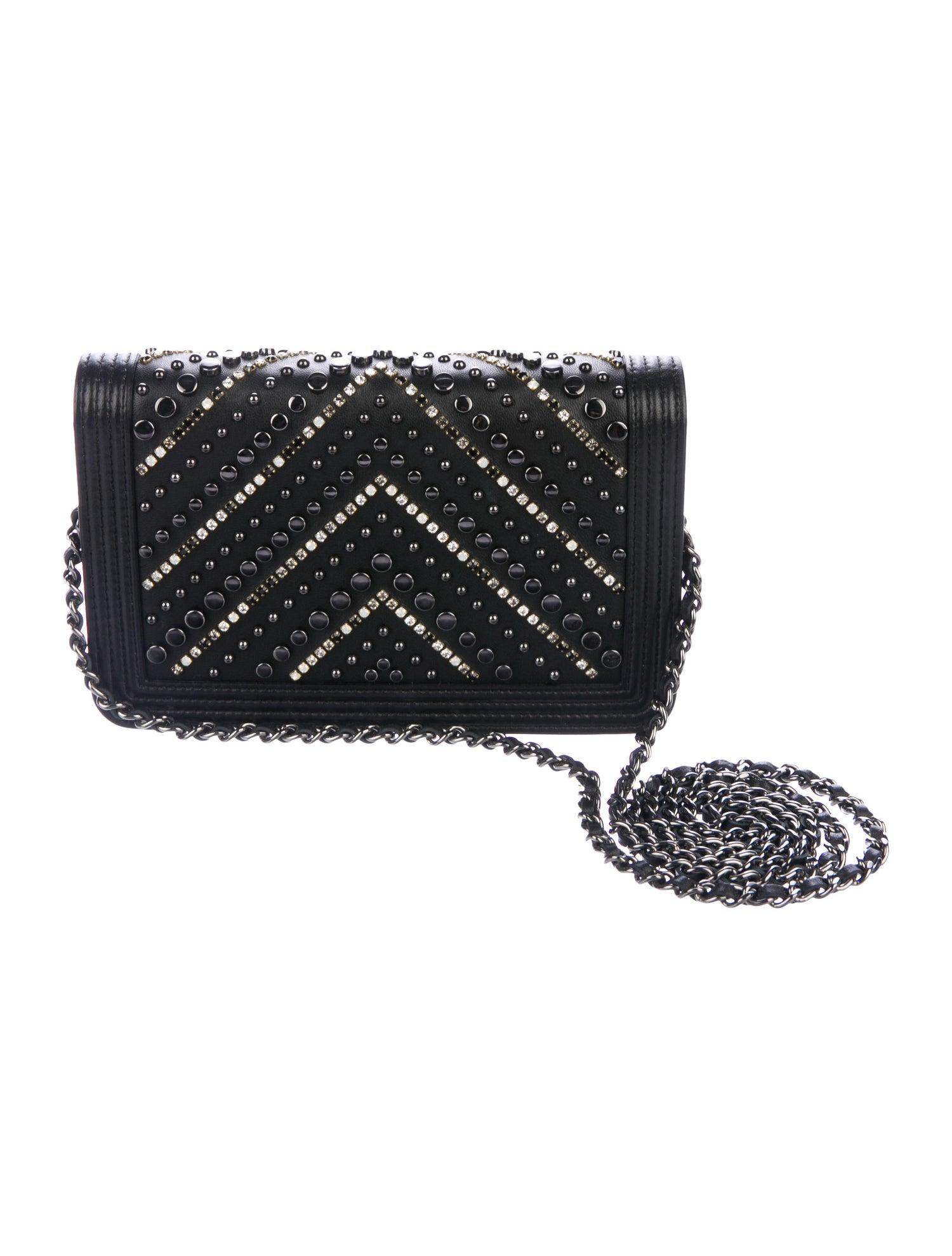 Chanel NEW Black Leather Crystal Stud Small WOC Wallet on Chain Boy Evening Shoulder Flap Bag in Box

Leather
Crystal
Silver tone hardware
Grosgrain lining
Magnetic snap closure
Feature six card slots 
Shoulder strap drop 25