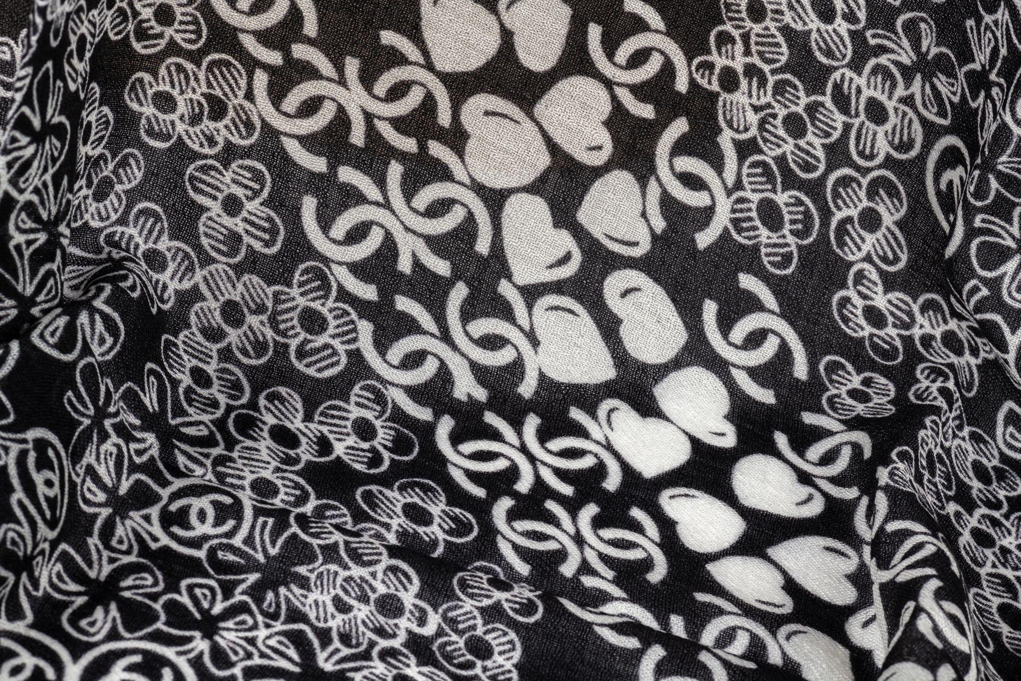 Chanel new black white cashmere shawl. Clover and multi logo design. Care tag attached .
