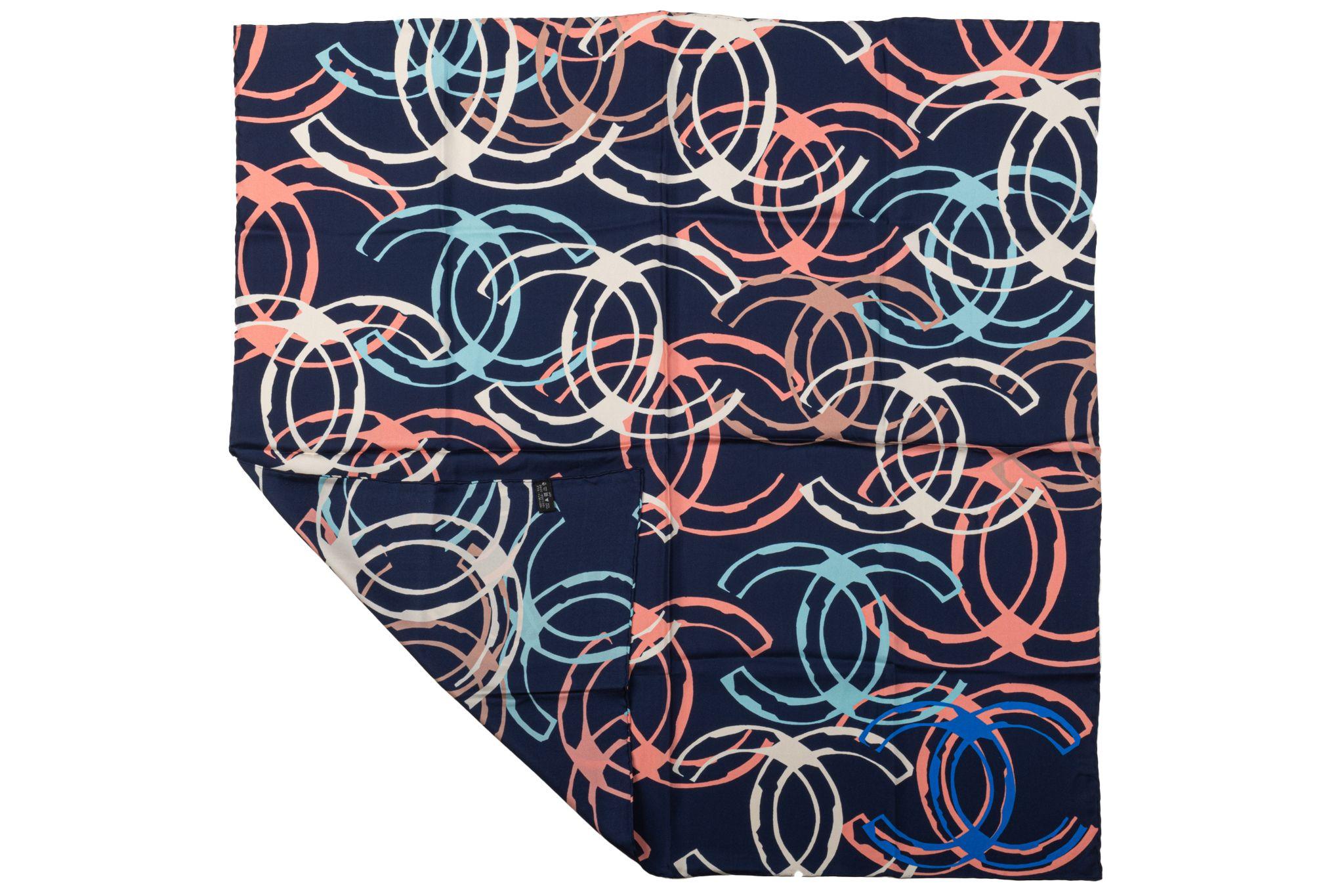 Chanel new blue silk scarf with multicolor logo design. Hand rolled edges.