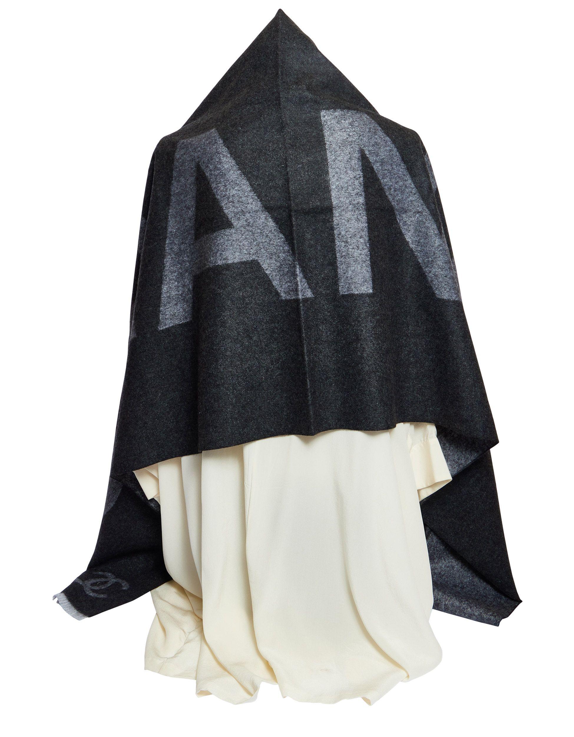 Beautiful and warm grey reversible shawl with contrasting Chanel letters and CC logo. It s made 88% of cashmere and 12% of silk.