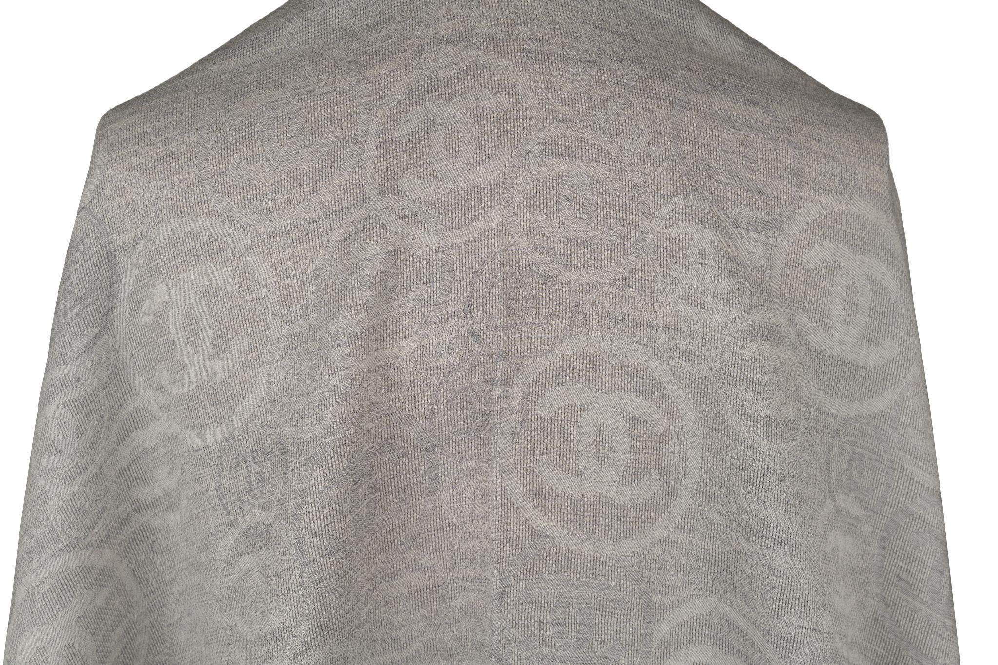 Chanel new square grey large shawl with logo design. 100% cashmere. Fringed edges. Classic and stylish.