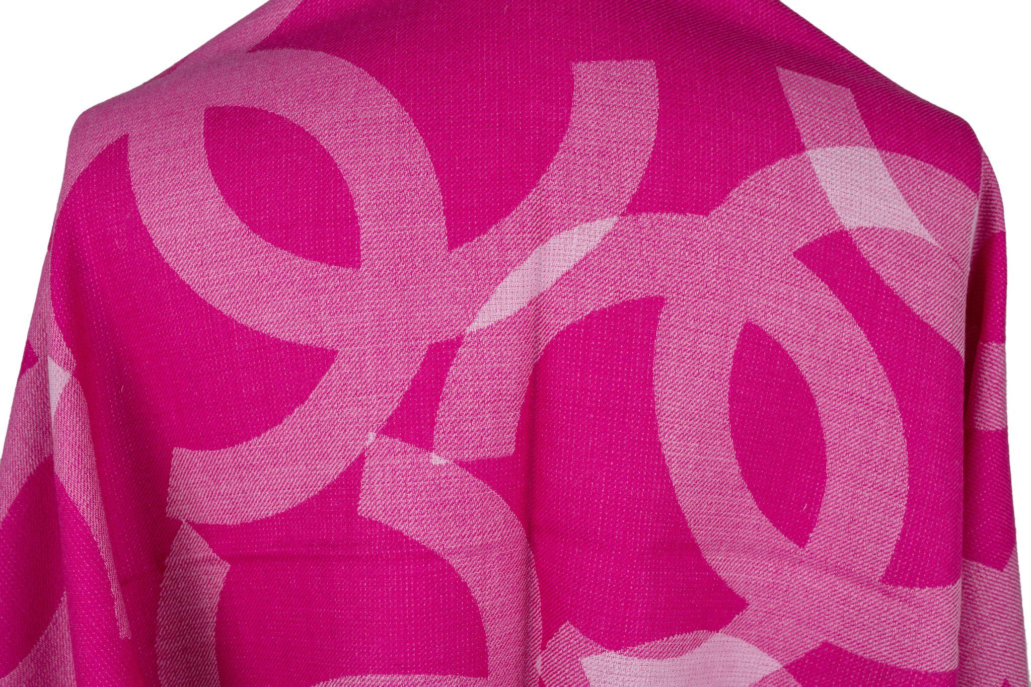 Chanel Cashmere Shawl in fuchsia. The pattern features big overlapping CC logos. The item is in new condition.