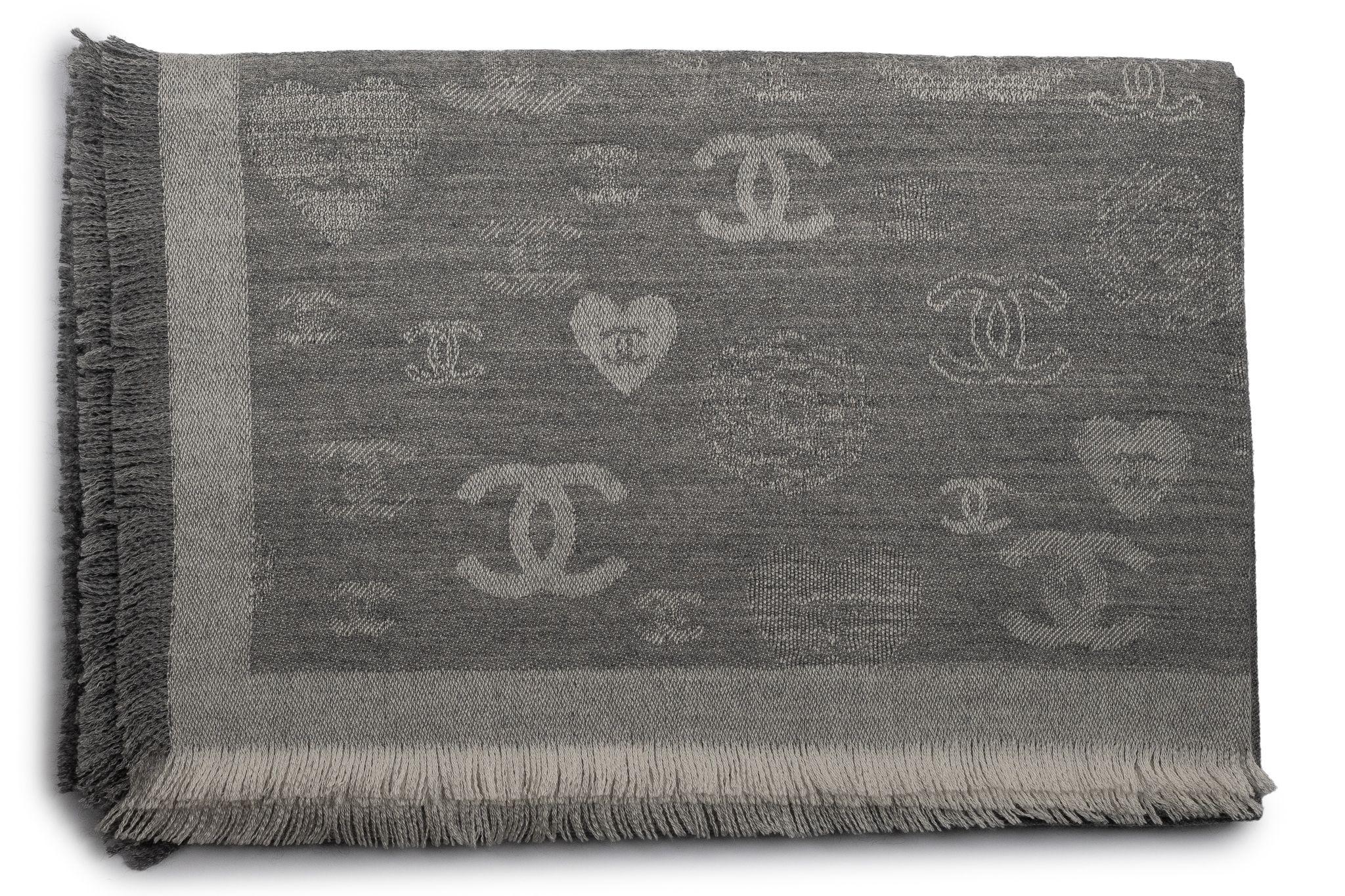 Chanel Cashmere Shawl in grey. The pattern features hearts and small CC logos. The item is in new condition.