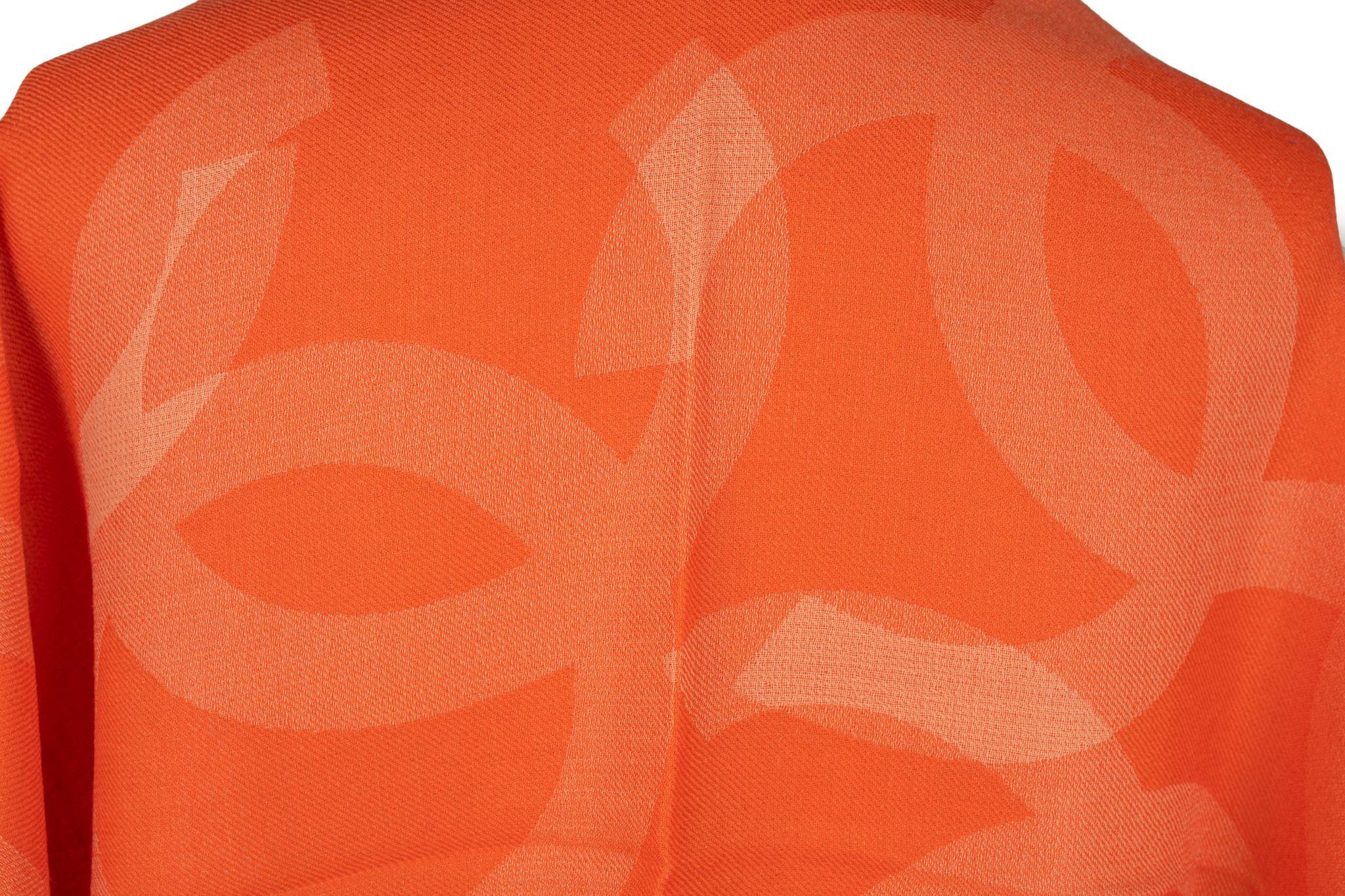 Chanel Cashmere Shawl Orange. The pattern features big overlapping CC logos. The item is in new condition.