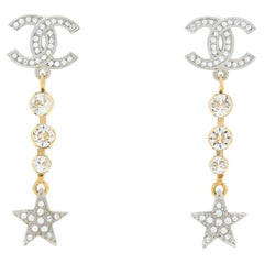 CHANEL NEW CC Crystal Gold and Silver Metal Star Dangle Drop Evening Earrings