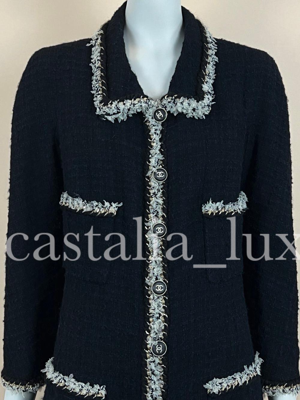 New stunning, collectible Chanel black tweed jacket with signature metallic chain link trim!
Boutique price over 9,000$
Size mark 40 fr. never worn.
- CC logo wood & metal buttons
- full silk lining with camellias