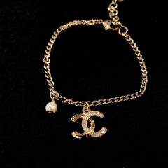 Chanel New Gold Tone CC Logo Rhinestones Dangle Faux Pearl Bracelet C21K, 2021