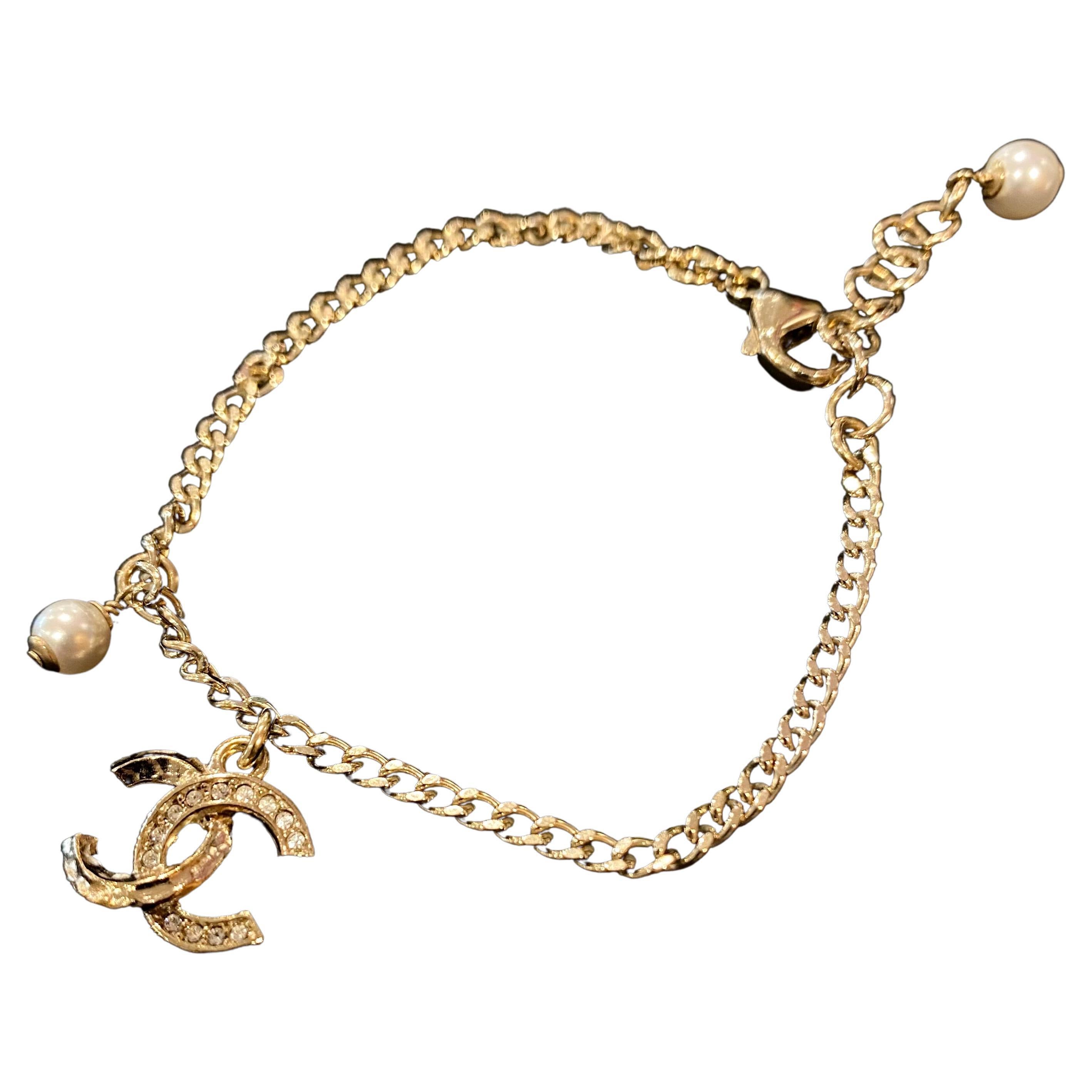 Chanel New Gold Tone CC Logo Rhinestones Dangle Faux Pearl Bracelet C21K, 2021 For Sale