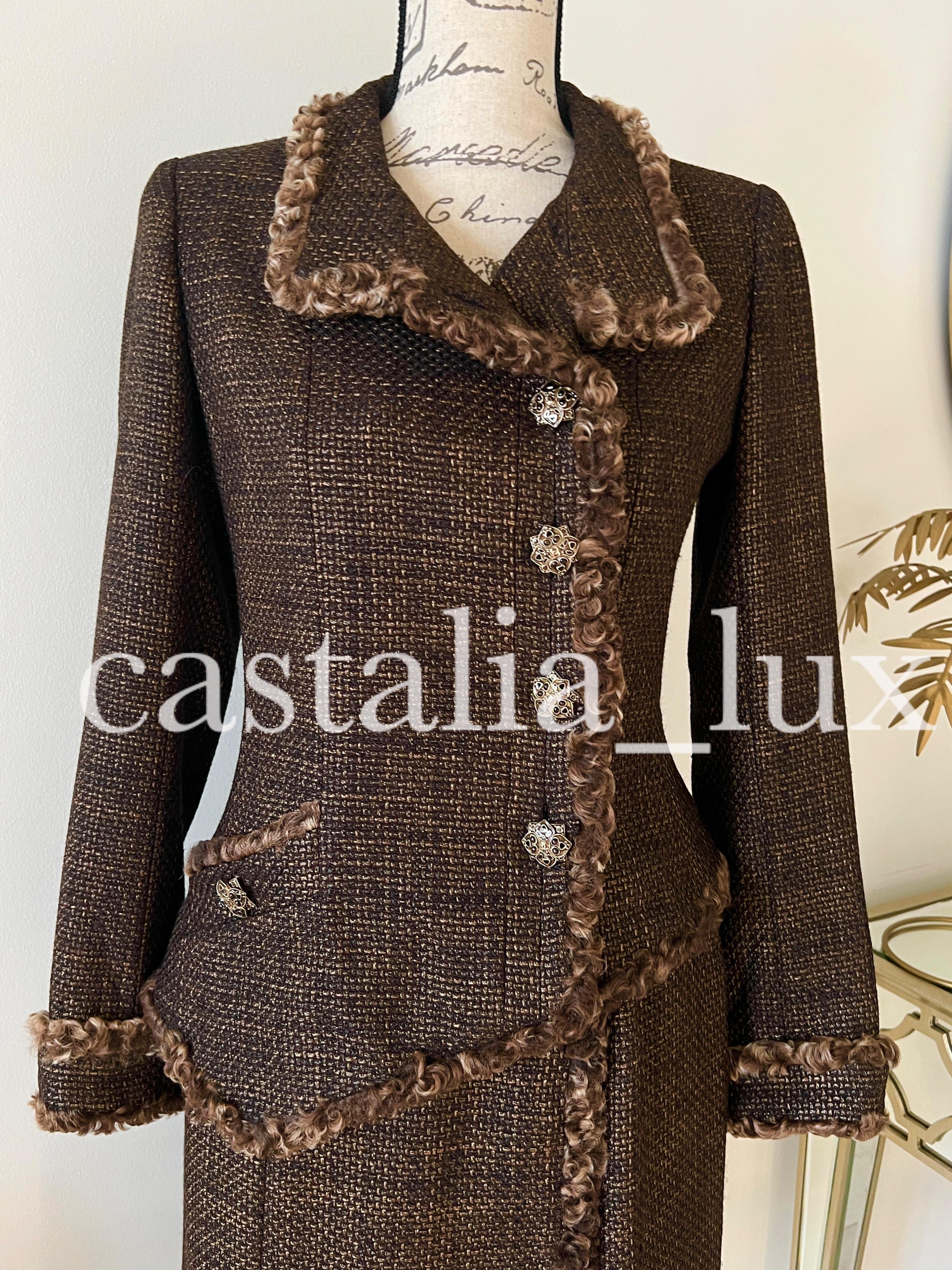 New, Extremely rare Chanel chocolate brown suit ( jacket and skirt) made of precious Lesage tweed. 
- stunning CC logo jewel Gripoix buttons
- precious lesage tweed with intricate bronze shimmer
- CC logo charm at skirt waist
- fully lined with