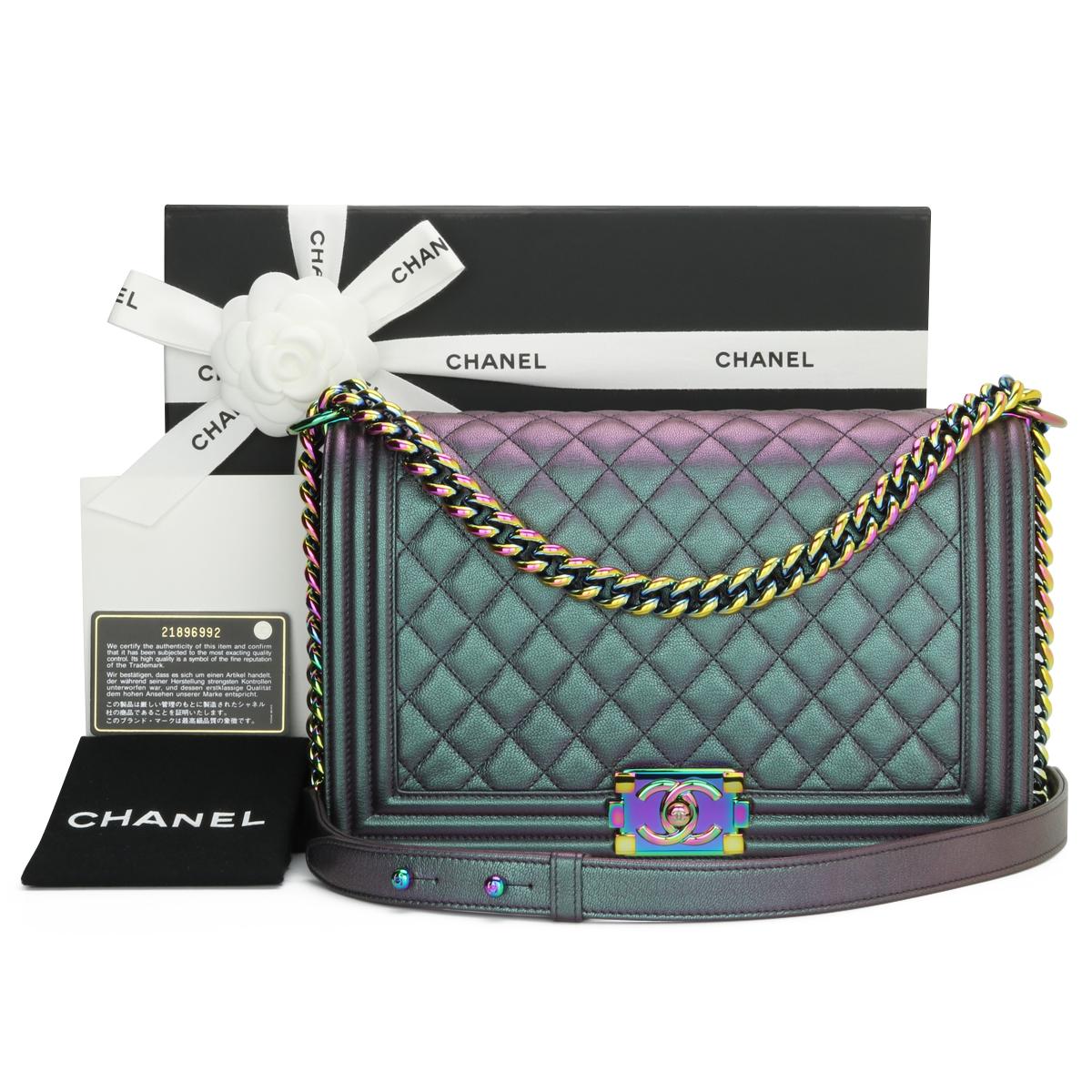 CHANEL New Medium Boy Bag Quilted Iridescent Purple Goatskin with Rainbow Hardware 2016.

This stunning bag is still in pristine - never worn condition, the bag still holds its original shape, and the hardware is still very clean and shiny.

It is a