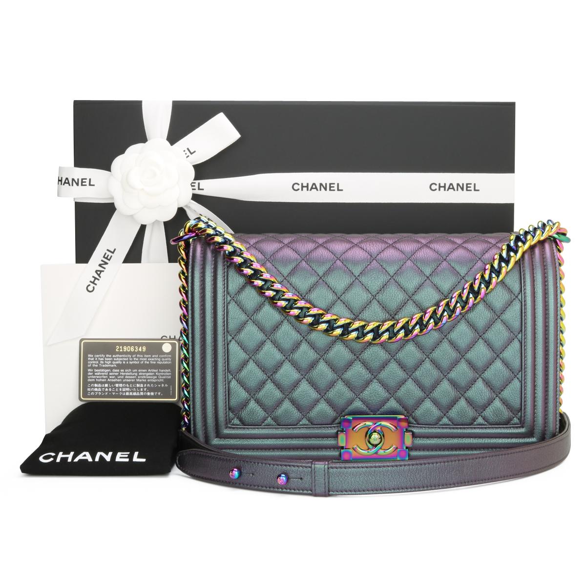 CHANEL New Medium Boy Bag Quilted Iridescent Purple Goatskin with Rainbow Hardware 2016.

This stunning bag is still in pristine condition, the bag still holds its original shape, and the hardware is still very clean and shiny.

It is a truly