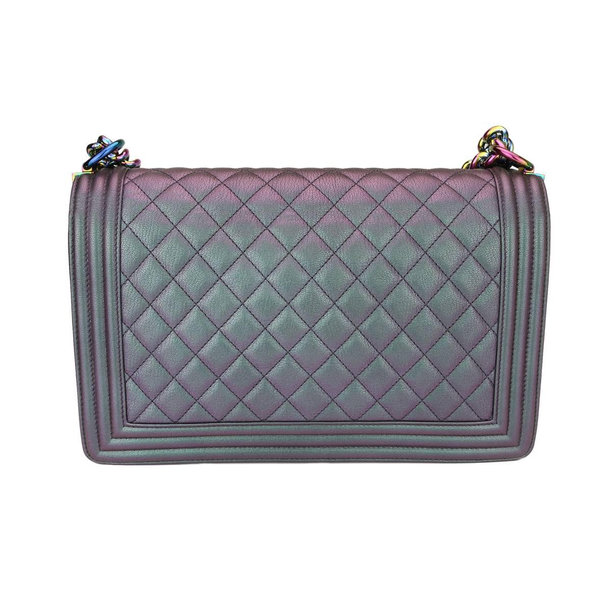 Authentic Chanel New Medium Boy Iridescent Purple Goatskin with Rainbow Hardware 2016.

This stunning bag is still in a mint condition, the bag still holds its original shape, and the hardware is still very clean and shiny.

Exterior Condition: