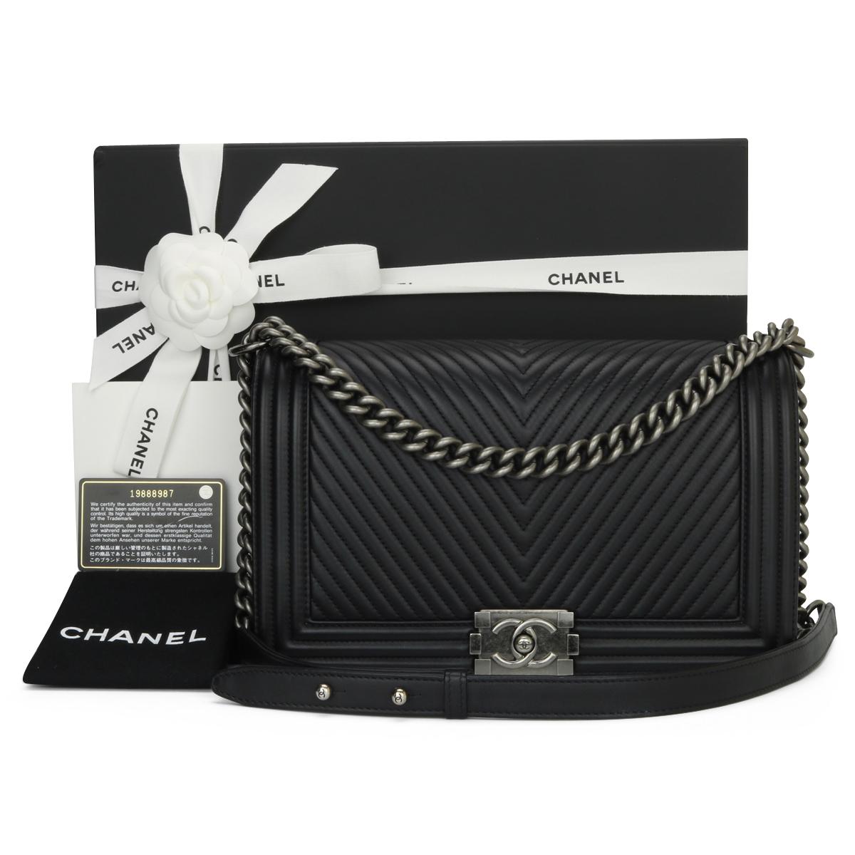 CHANEL New Medium Chevron Boy Bag Black Calfskin with Ruthenium Hardware 2014.

This stunning bag is still in excellent condition, the bag still holds its original shape and the hardware is still very clean and shiny.

- Exterior Condition: