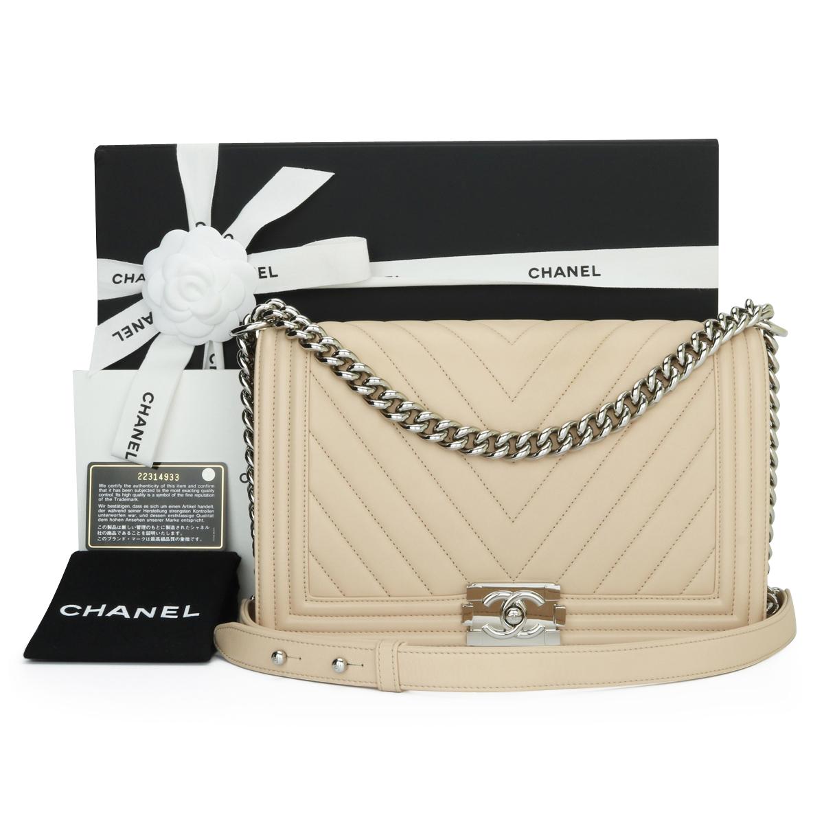 CHANEL New Medium Chevron Boy Bag Nude Calfskin with Silver Hardware 2016.

This stunning bag is still in excellent condition, the bag still holds its original shape and the hardware is still very clean and shiny.

- Exterior Condition: Excellent