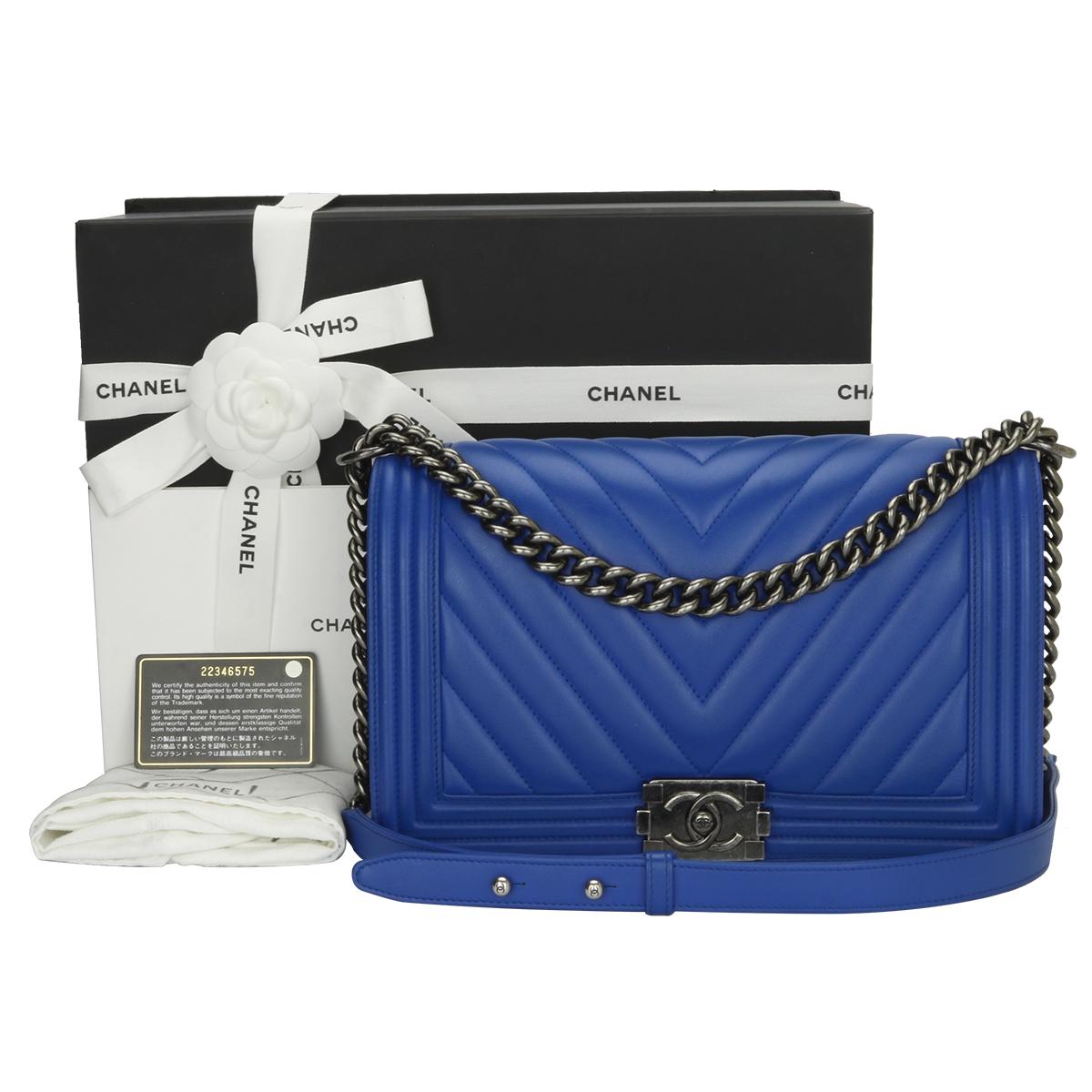 Authentic CHANEL New Medium Chevron Boy Blue Calfskin with Ruthenium Hardware 2016.

This stunning bag is still in a mint condition; it still keeps its original shape and the hardware still very shiny.

Exterior Condition: Mint condition, corners