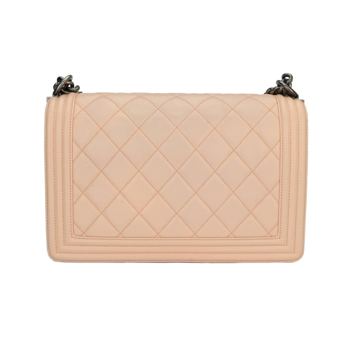Authentic CHANEL New Medium Large Quilt Boy Pink Calfskin with Ruthenium Hardware 2015.

This stunning bag is still in an excellent condition; it still keeps its original shape well and the hardware still very shiny.

Exterior Condition: Excellent