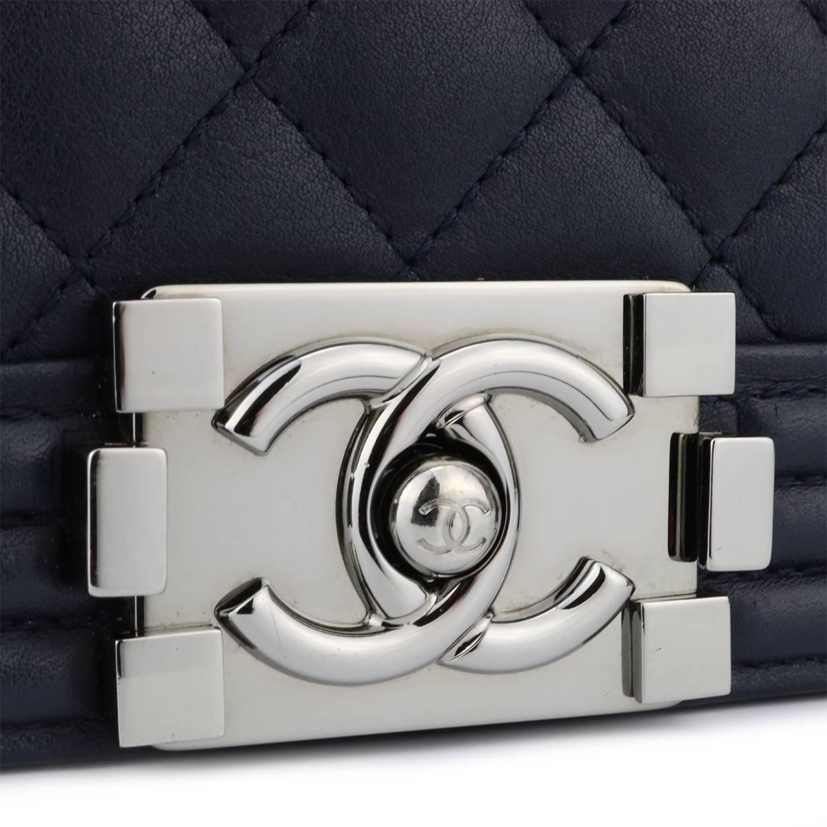 Authentic CHANEL New Medium Quilted Boy Navy Calfskin with Light Gunmetal Hardware 2015.

This stunning bag is still in a mint condition, the bag still holds its original shape and the hardware is still very clean and shiny.

Exterior Condition: