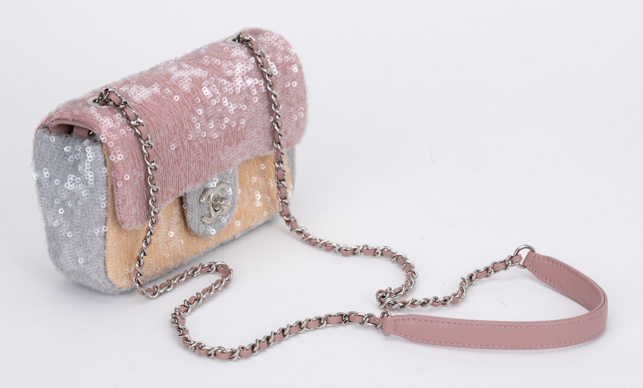 Chanlel new mini rectangular sequins cross body flap bag.New condition with plastic on hardware. Celeste, pink and yellow color combo with silver hardware. Lined in pink leather. Shoulder drop 22