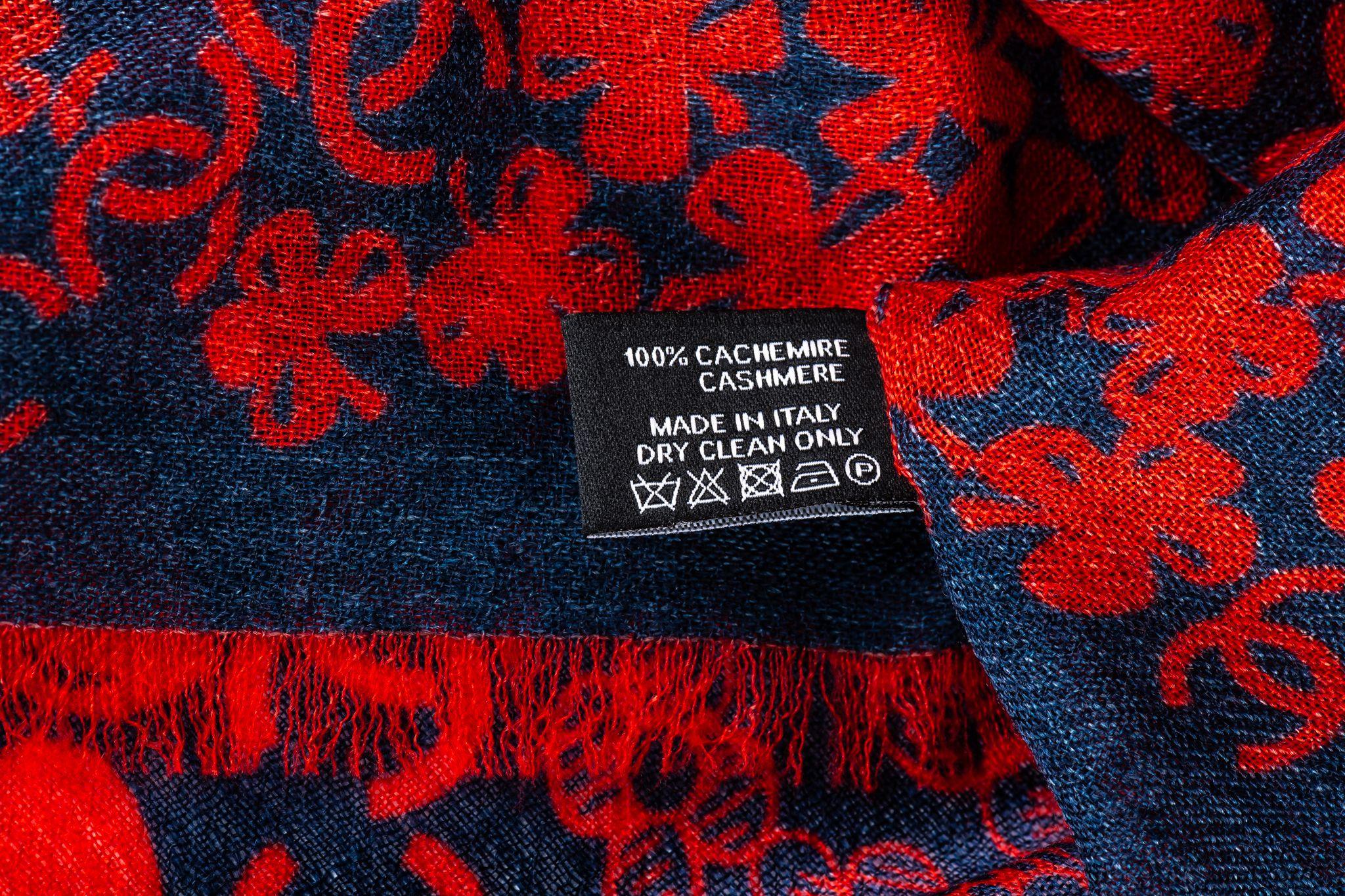 Chanel new navy and red cashmere shawl. Clover and multi logo design. Care tag attached.