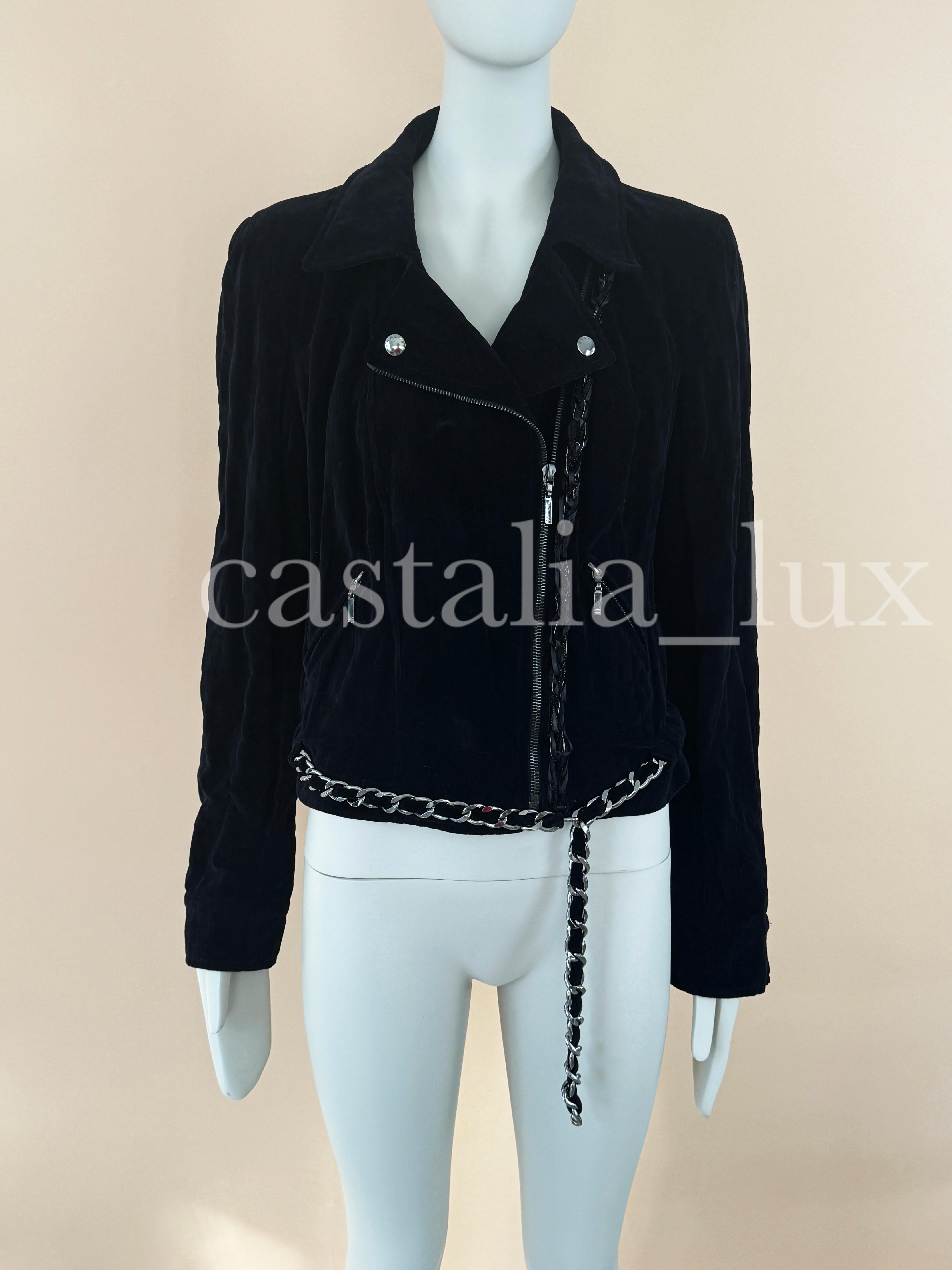 Collectible Chanel black velvet biker jacket with signature metallic chain link trim at hem!
A very rare find now!
- logo buttons at front and cuffs
- braided detail at side
Size mark 40 FR. Kept unworn.