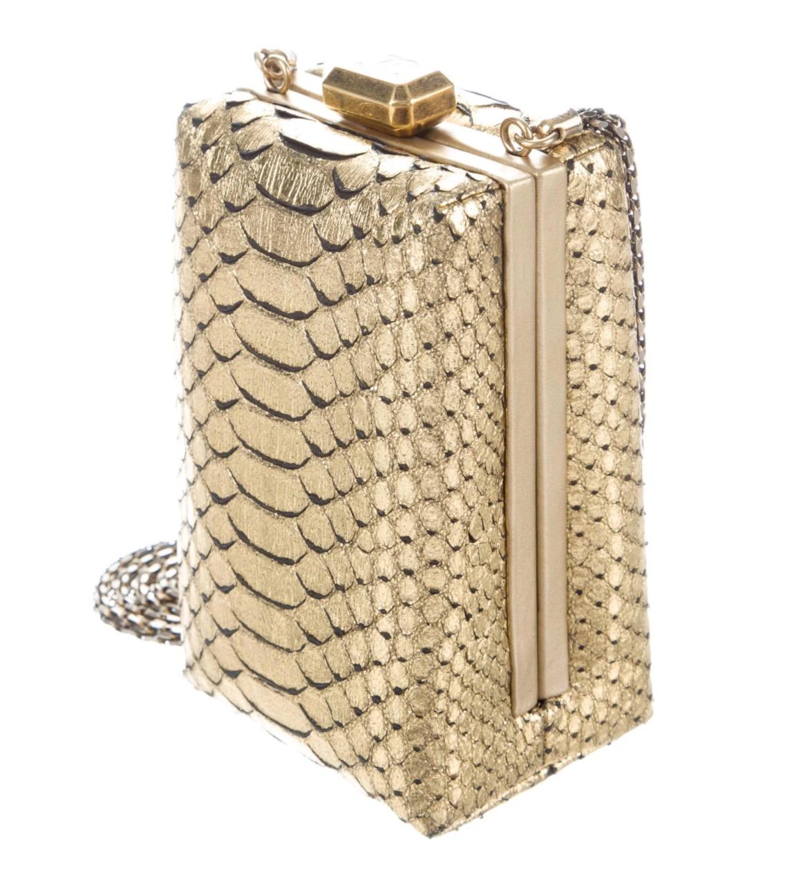 
Python 
Leather
Gold-tone hardware
Leather lining
Kiss-lock closure
Includes box
100% authenticity guaranteed

NEWFOUND LUXURY is the premier luxury fashion dealer on the 1stDibs platform. Since 2015, NEWFOUND LUXURY has maintained the ‘Recognized’