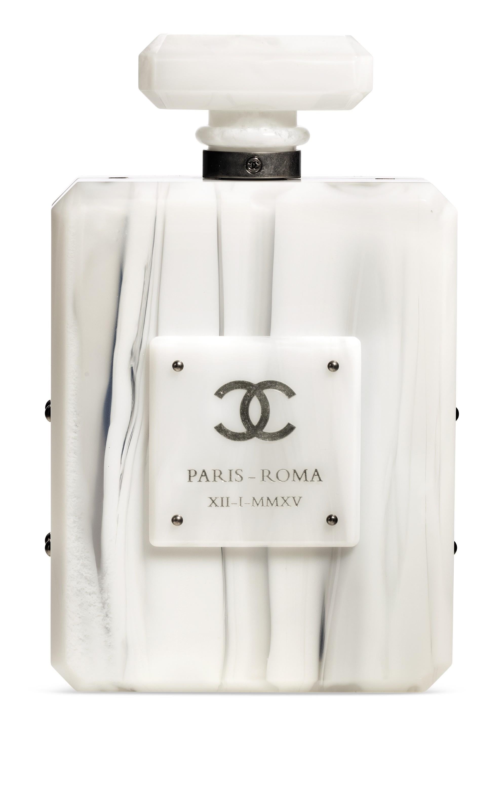 The Holy Grail of Chanel Bags.

From Chanel's 2016 Runway collection, this stunning lucite perfume bottle shoulder bag is a bonafide gem. Produced by Chanel in limited quantities, it includes all original accompaniments.  Acquired from a prestigious