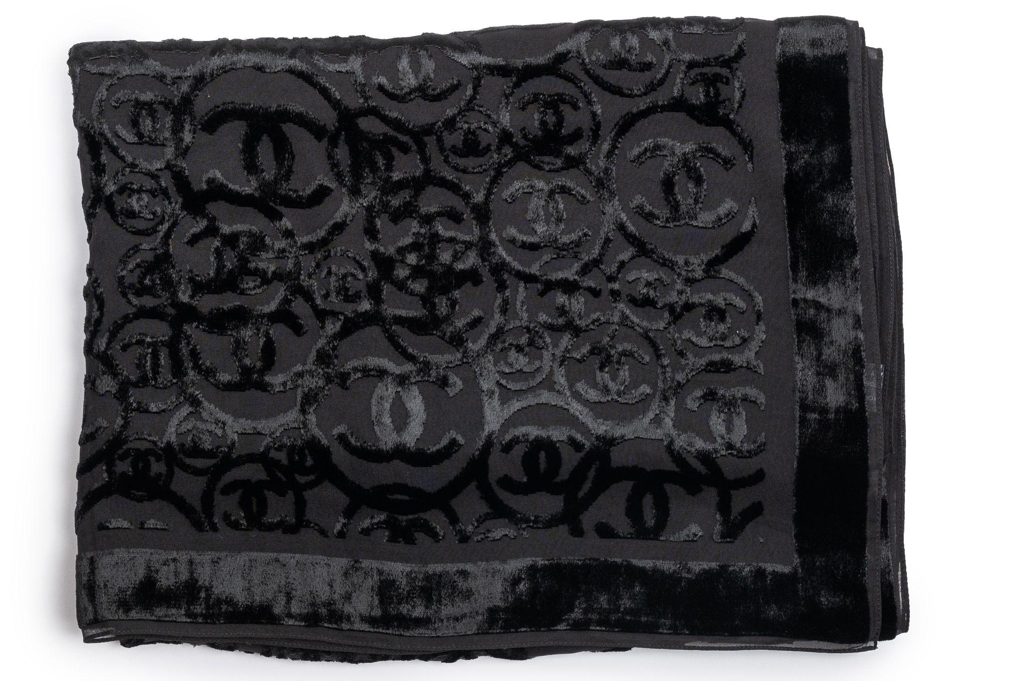 Chanel Silk-blend stole in black. The scarf is see thru and the pattern features several CC logos. The item is in new condition.