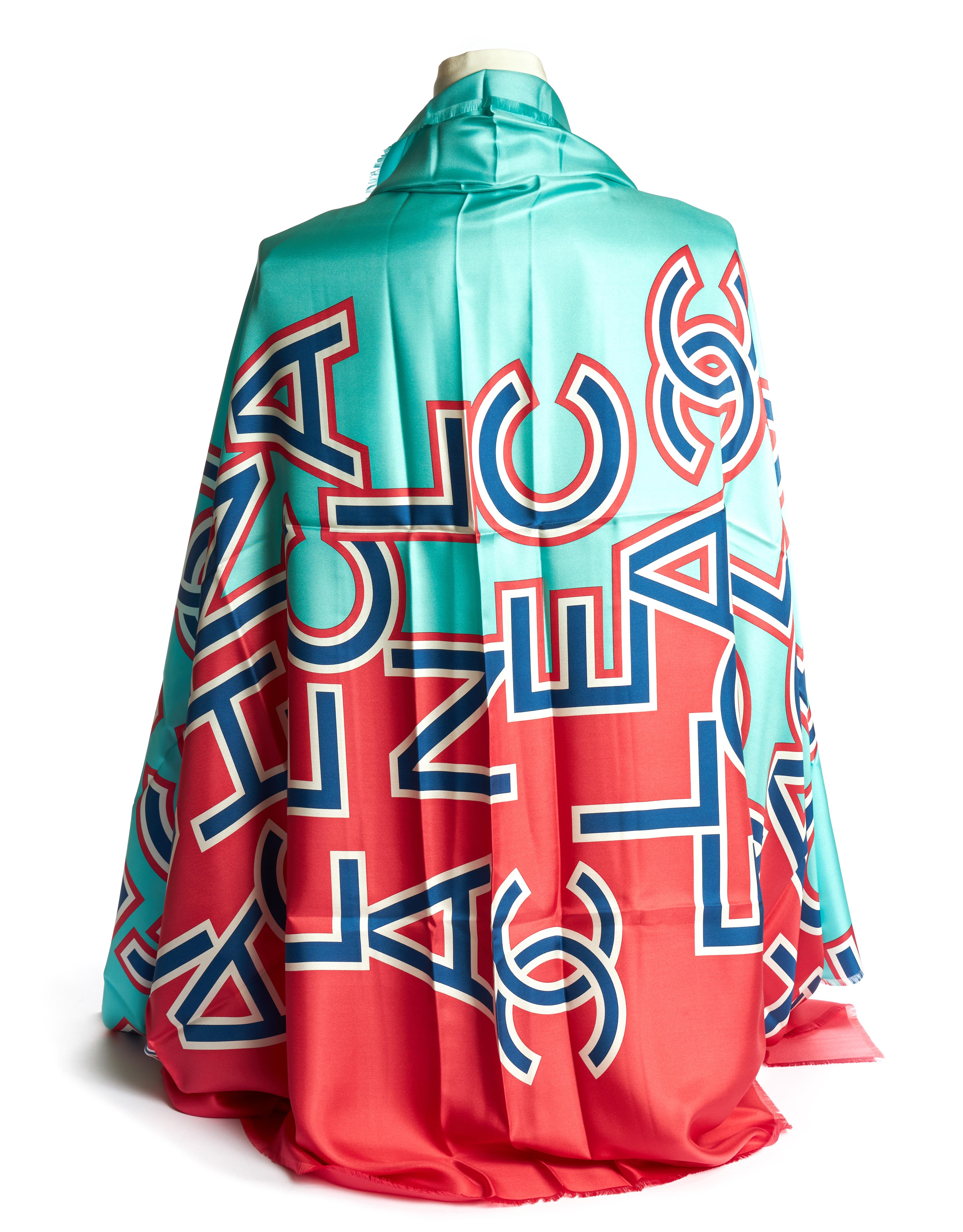 Chanel brand new in unworn condition oversize teal and coral scrambled letters shawl. 100% silk. Original care tag.
