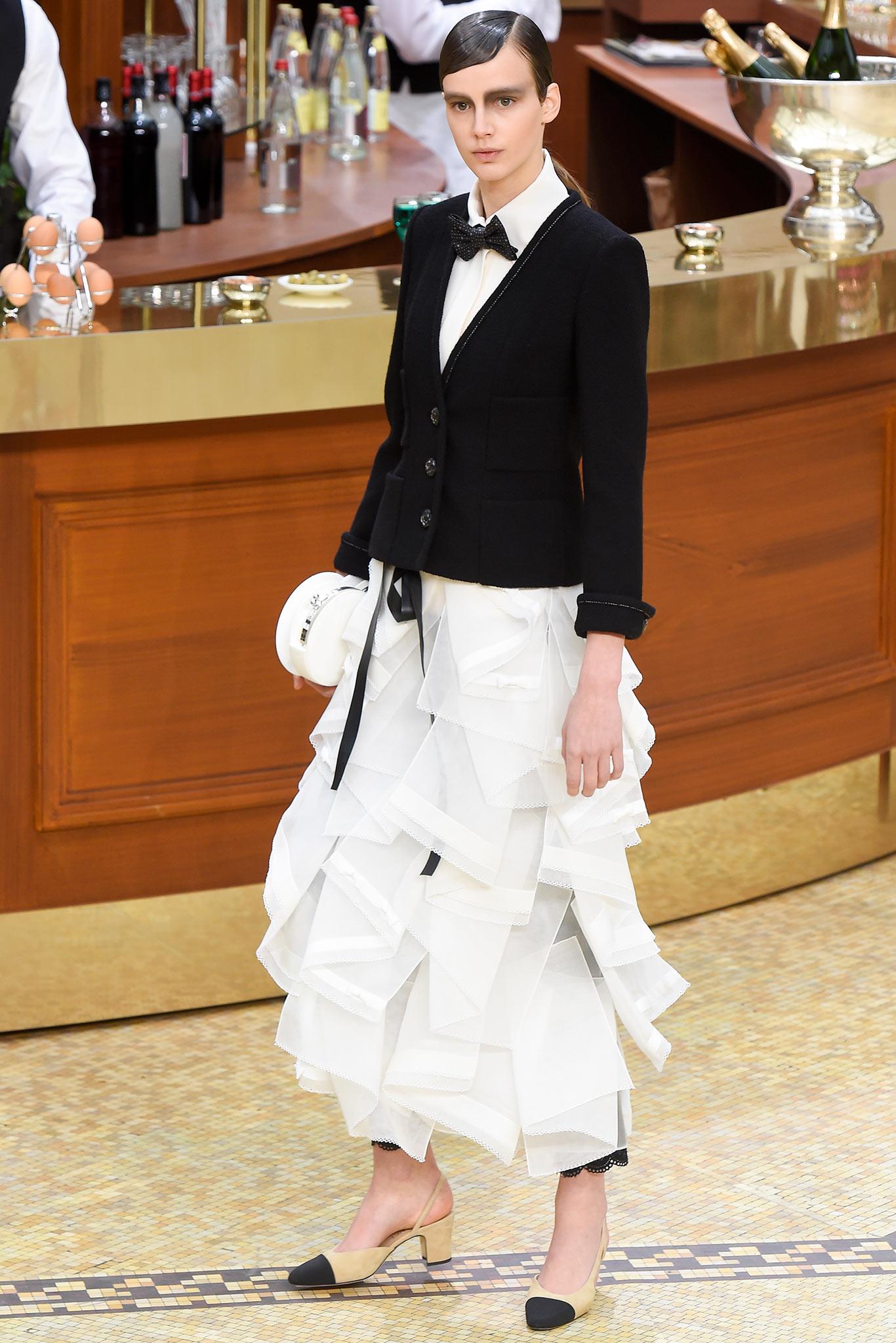 Chanel most iconic little black tweed jacket ~ interpretation of COCO Brasserie Collection ~ by Karl Lagerfeld
- as seen in Ad Campaign and on many celebs!
- CC logo Camellias buttons
- most recognisable 4-flap-pockets silhouette
- black silk