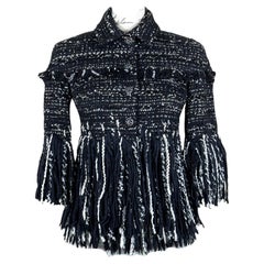Chanel - Veste en tweed noir en couverture de Vogue 