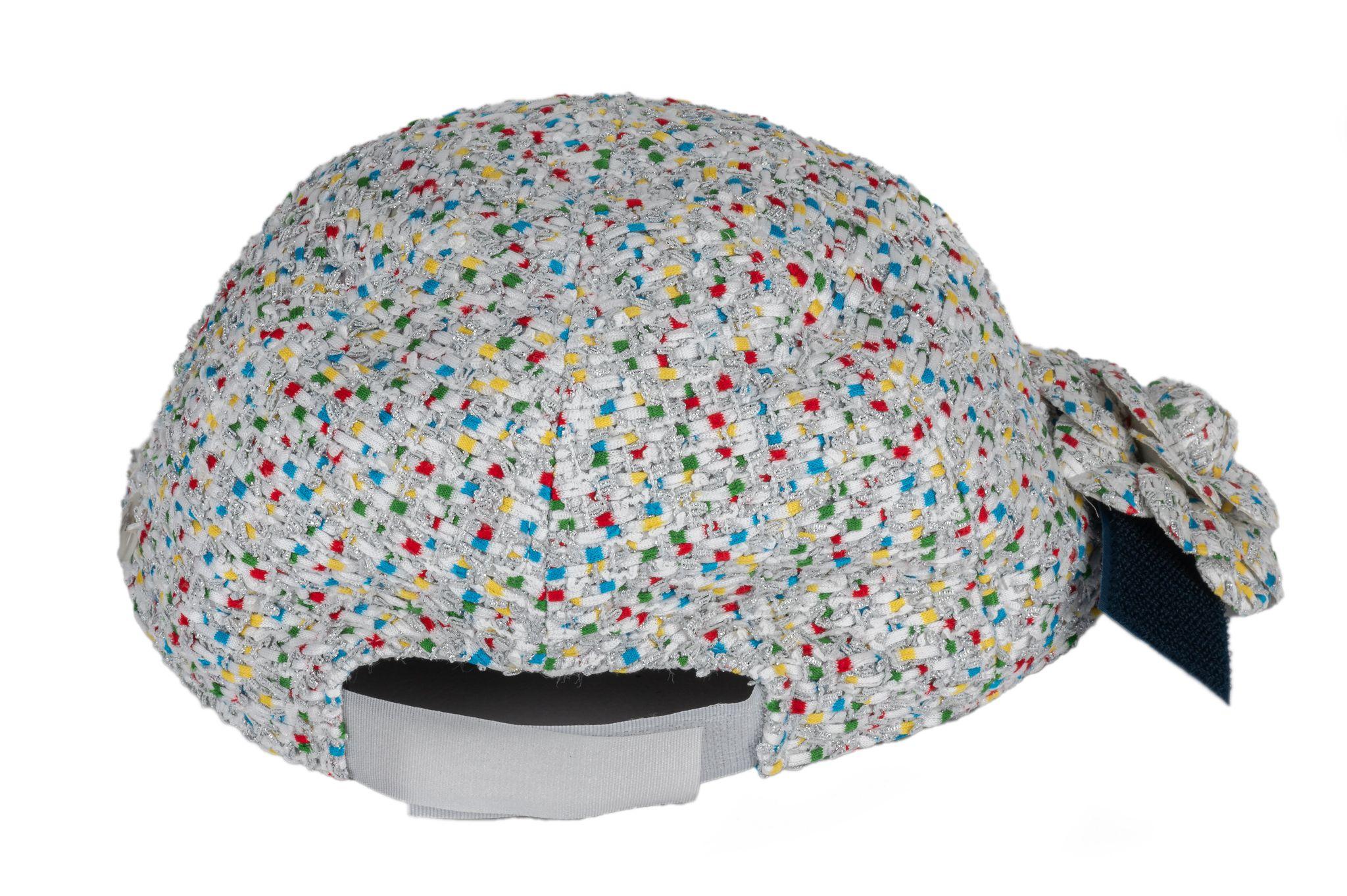 Chanel new white tweed and multicolor baseball hat, medium with adjustable back velcro strap. Detachable camellia pin, can be worn separately. Comes with original box.