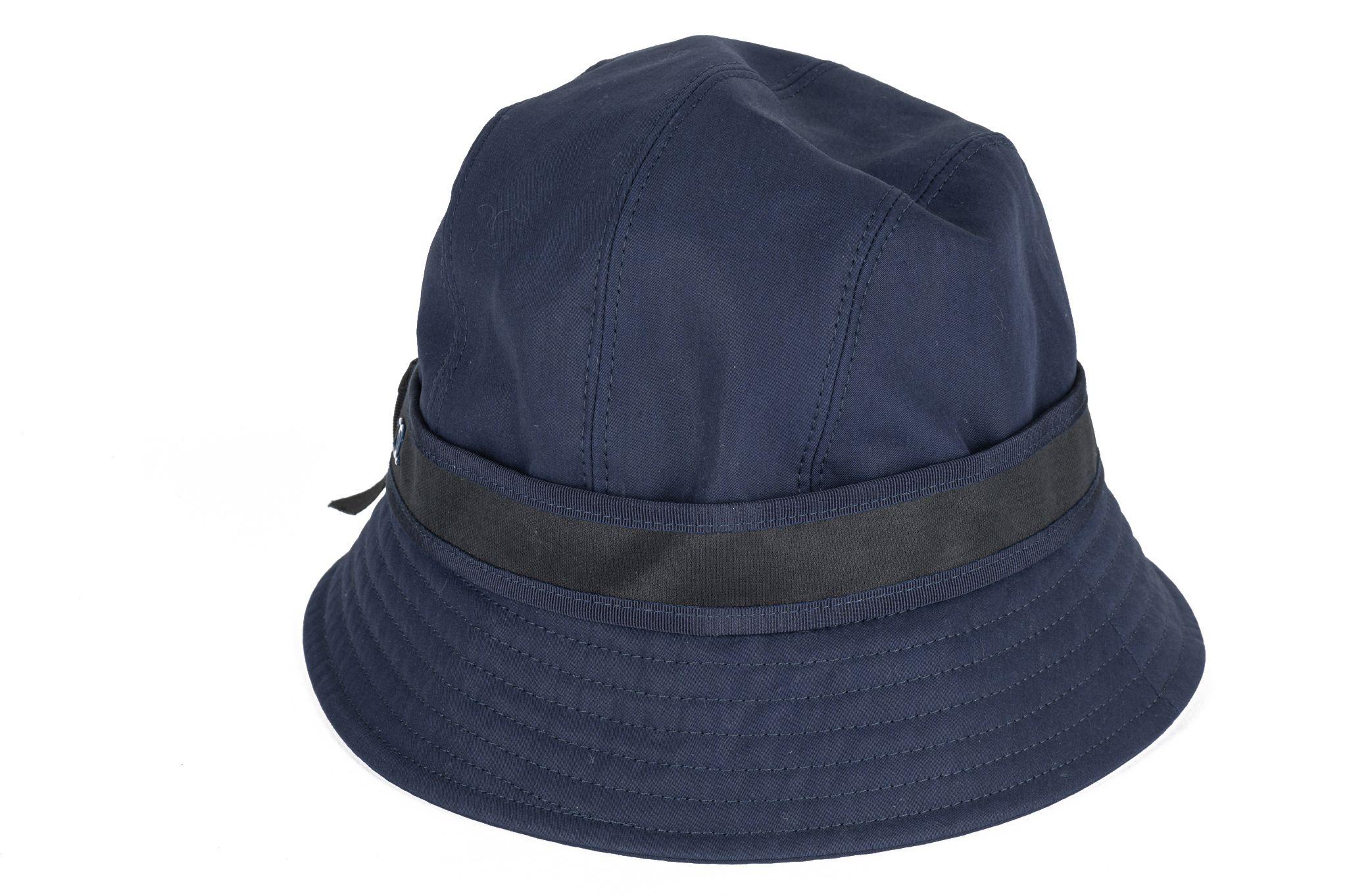 Chanel new blue bucket hat with black ribbon. Label 57 European size, us size 7 1-8. 97% cotton, 3% viscose. Comes with original box.