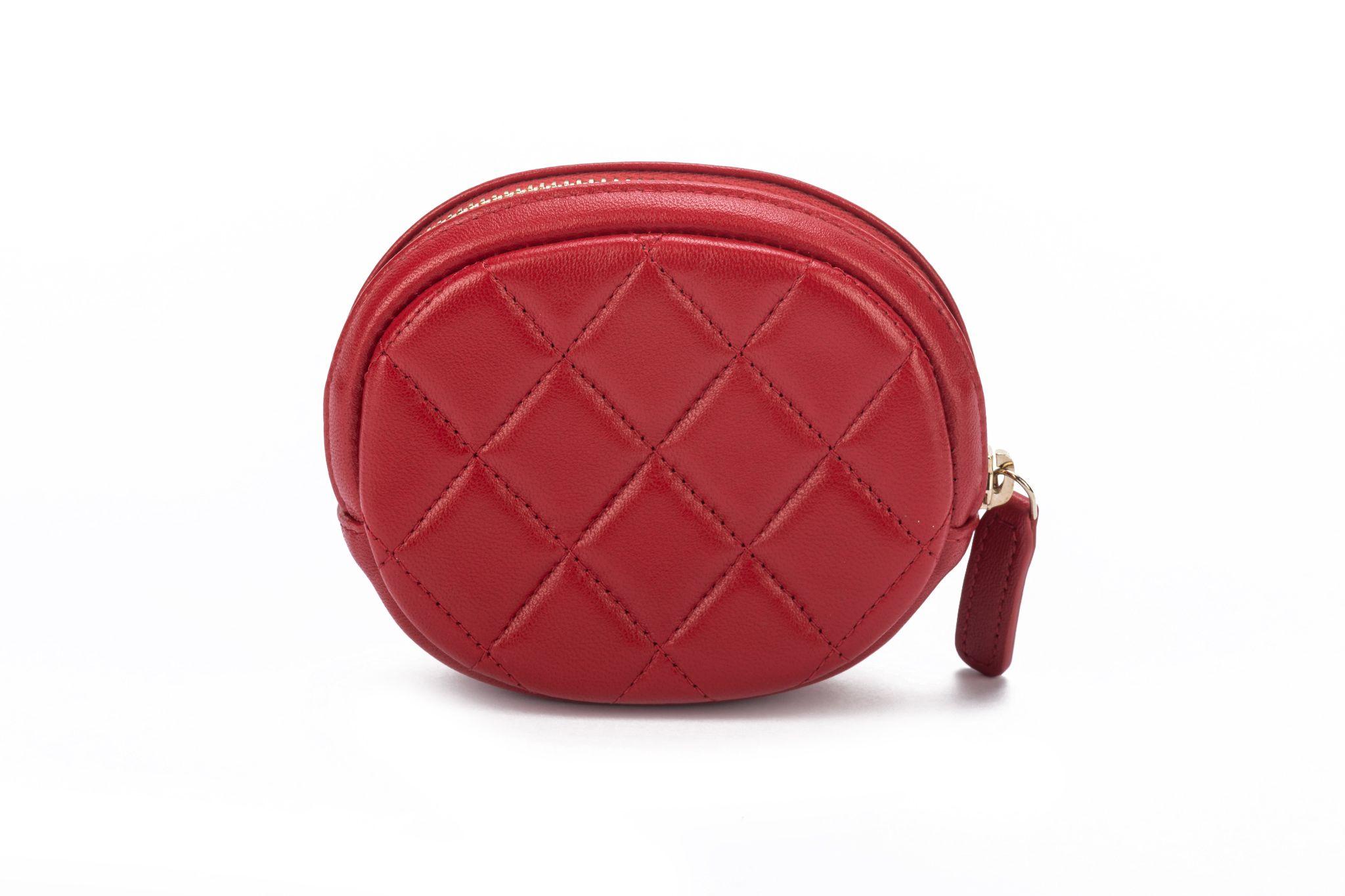Chanel new in box oval red quilted caviar coin case with champagne gold logo. Collection 29. Comes with hologram, ID card, booklet, dust cover and box.