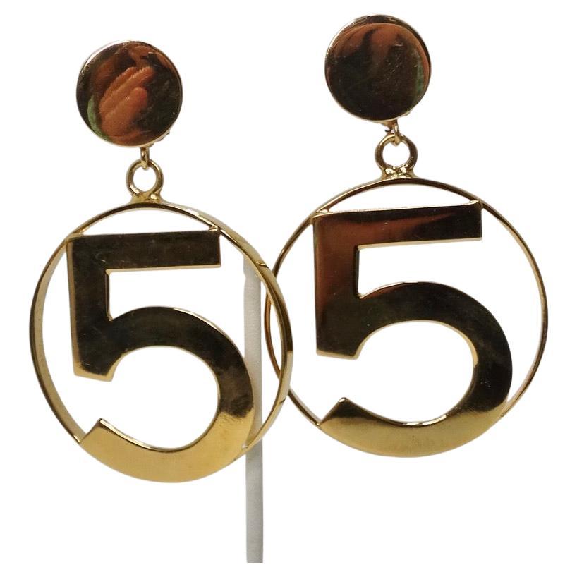 Calling all Chanel lovers! These absolutely iconic jumbo Chanel No 5 gold hoops circa 1980s are begging to be added to your collection! Gorgeous solid gold plated large hoop earrings in Chanel's signature 'No 5' motif with clip on backs. Perfect for